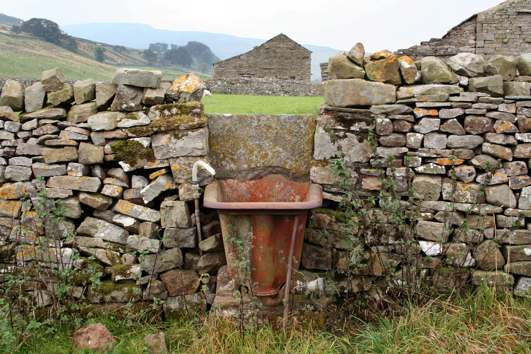 Rusted Bath in Drystone Wall
