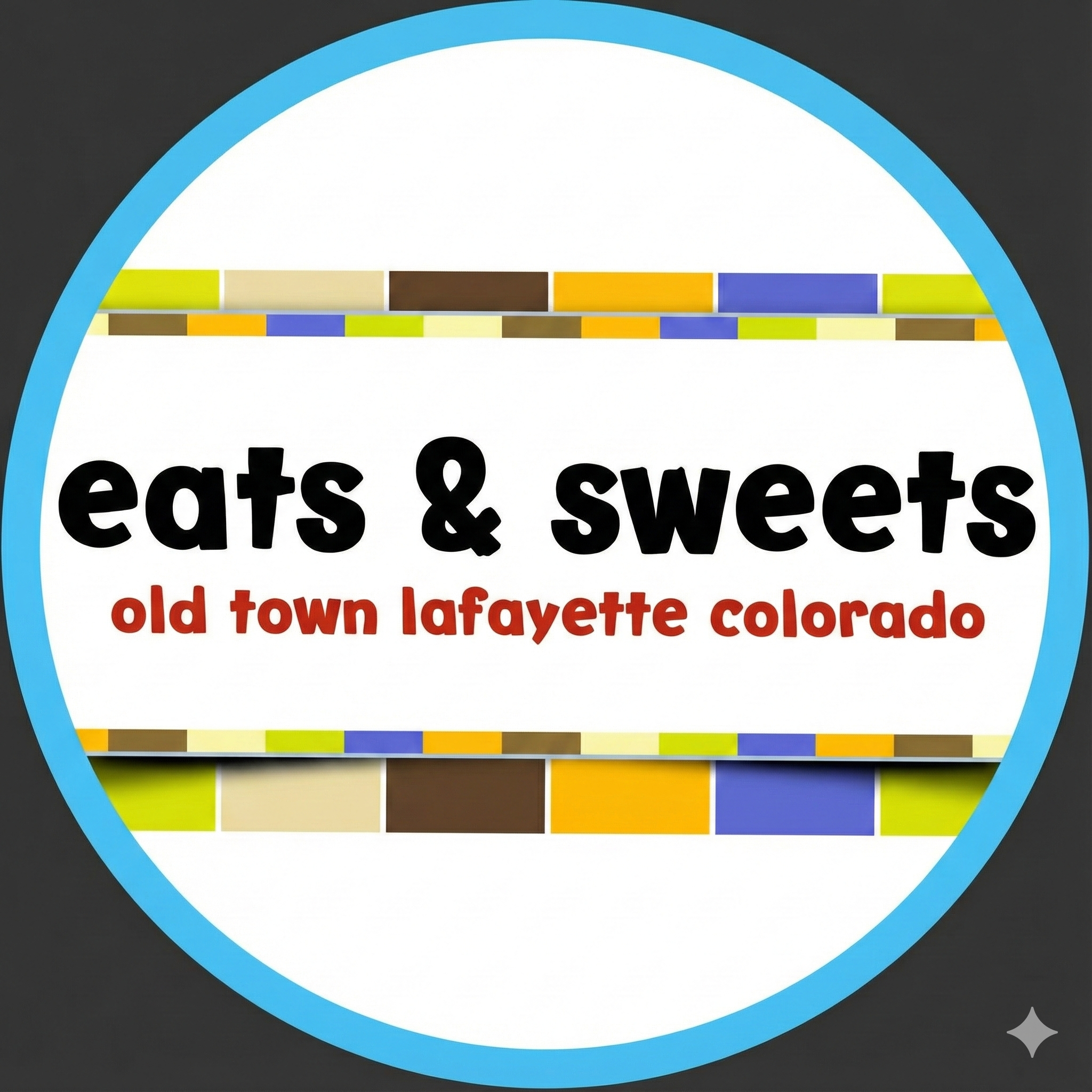 A circular sign with a blue border advertising a store called 'eats & sweets' located in Old Town Lafayette, Colorado, decorated with colorful tiles.