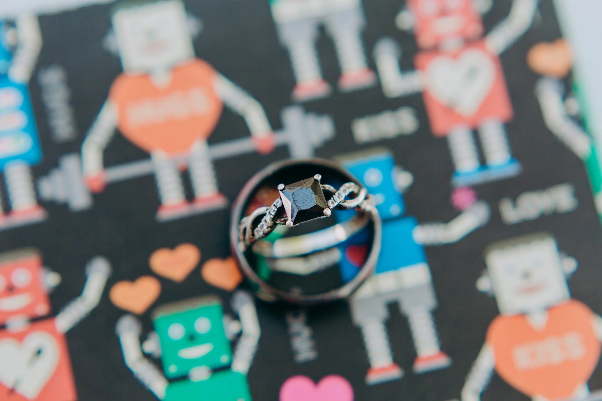 A detail shot of the bride's ring inside the groom's
