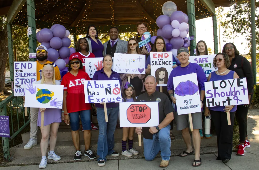 SAFE Southeast Advocates for Family Empowerment volunteers and staff standing together against domestic violence southeast Louisiana