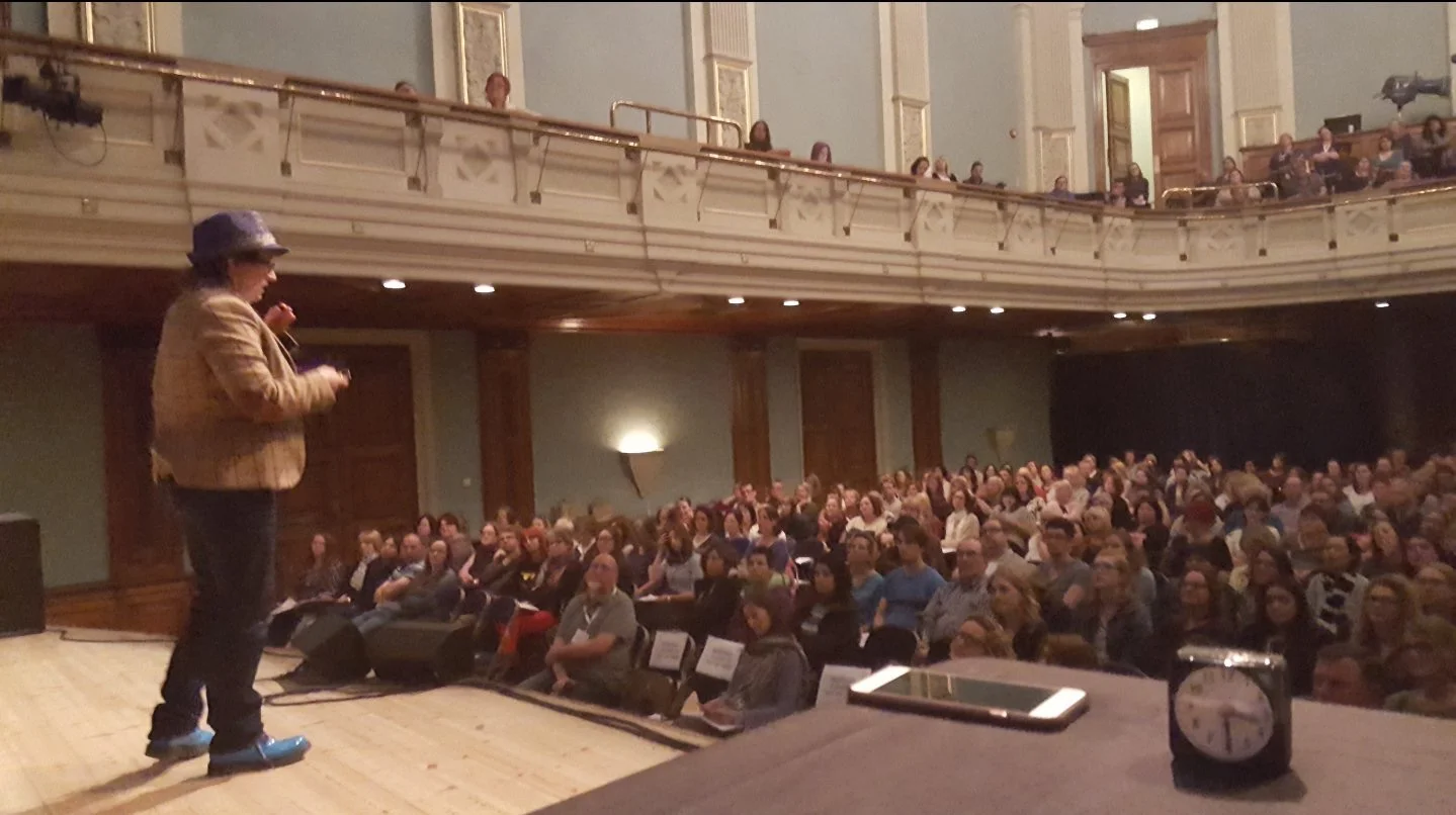 Photo of me speaking at Reading town hall on the same bill as Dr Temple Grandin