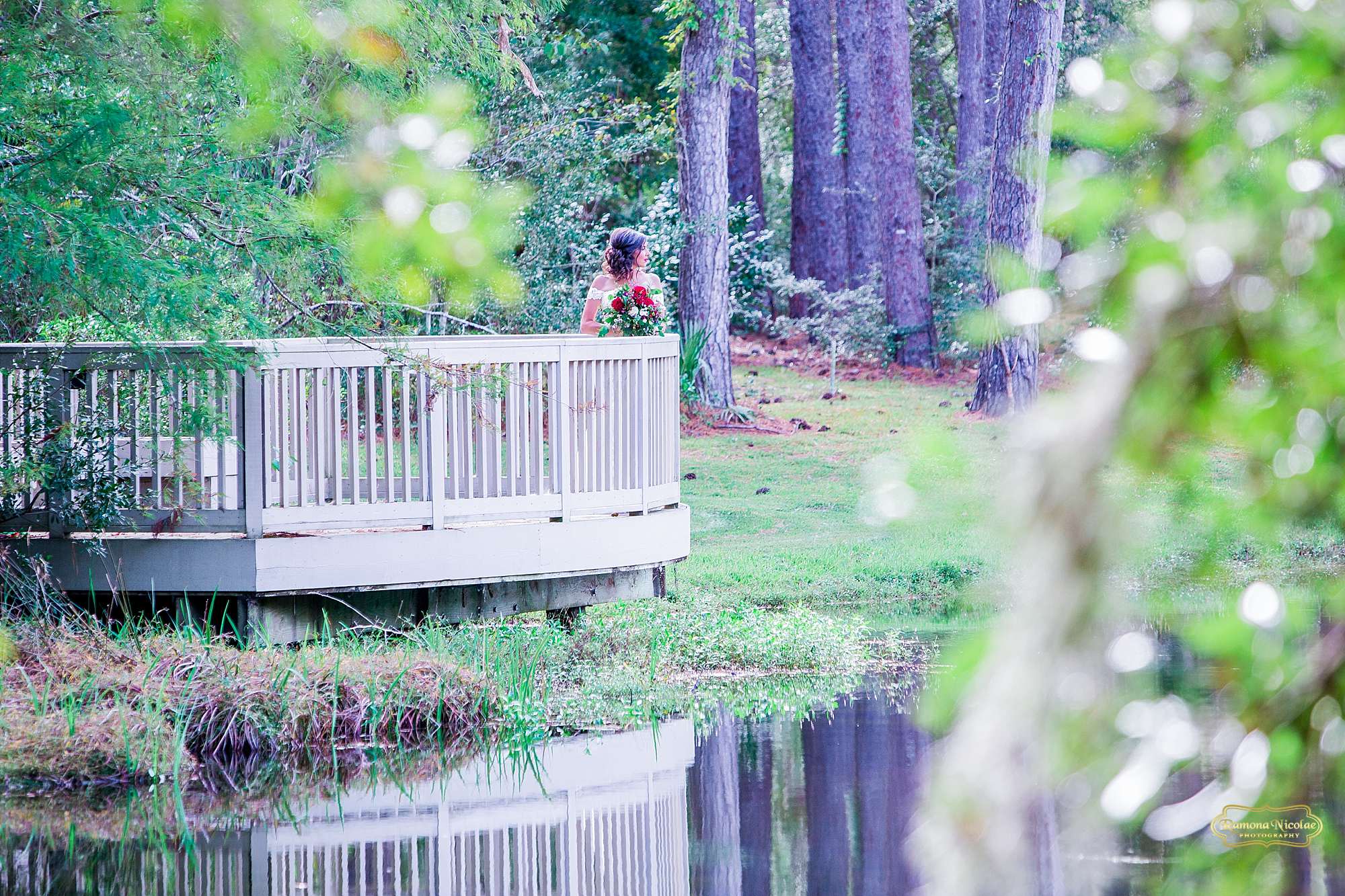 bride on a balcony by the water at brookgreen gardens for bridal session with ramona nicolae photography-1.jpg