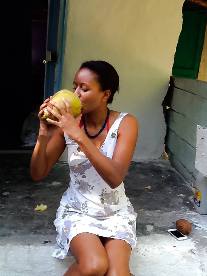 Enjoying coconut in Haiti