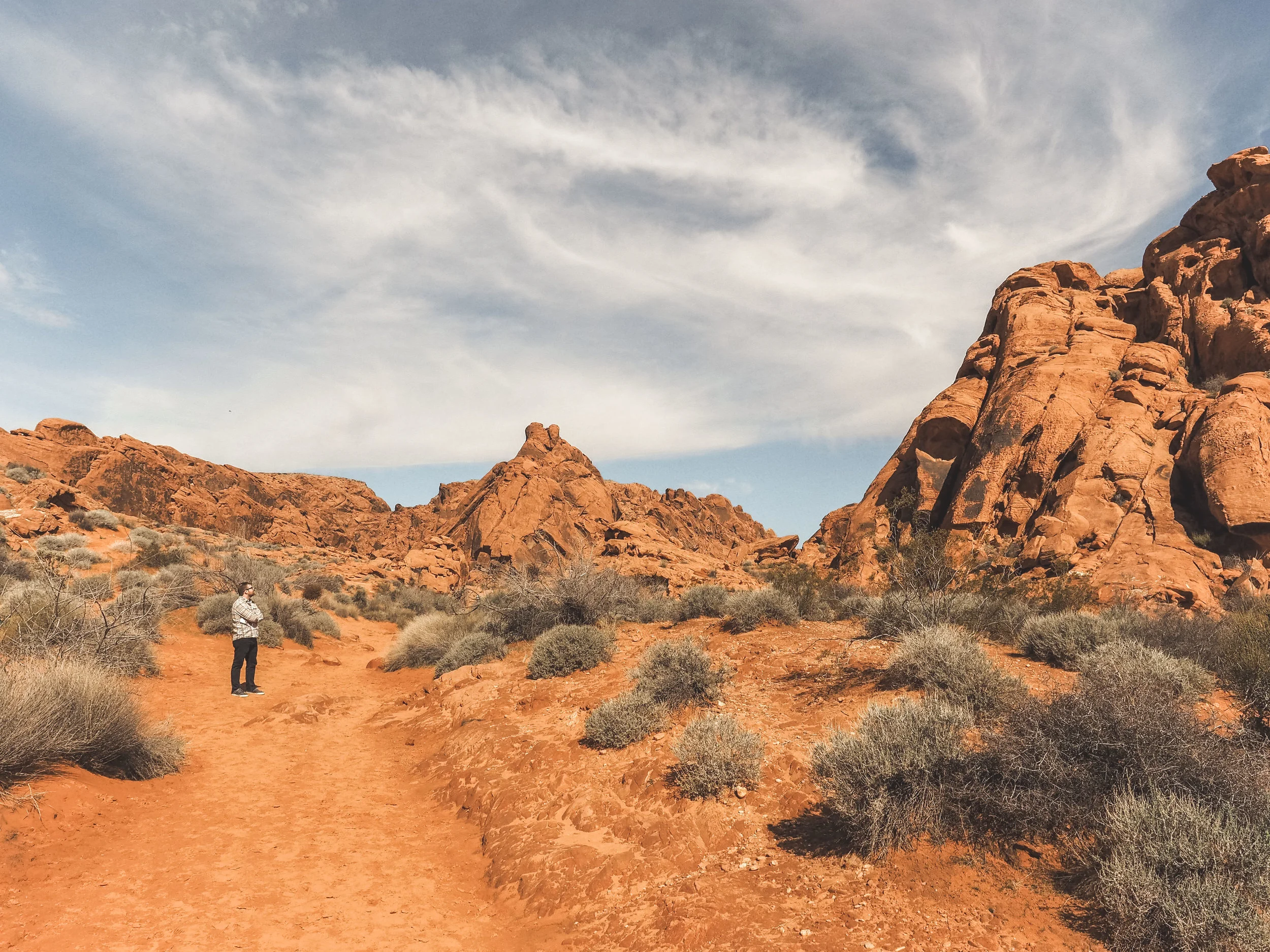 Valley of Fire state Park is home to some amazing hiking trails in the middle of the Nevada desert. Explore views of colorful rock formations and even ancient petroglyphs! #valleyoffire #nevada #statepark #hiking