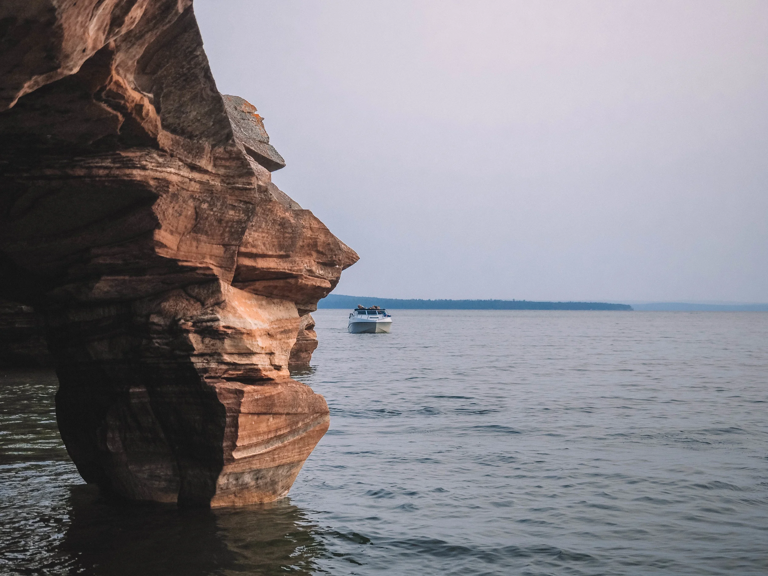 Spend your day sailing the Apostle Islands National Lakeshore in northern Wisconsin. A boat charter will give you access to hiking trails, kayaking routes and the gorgeous Apostle Islands sea caves. #apostleislands #wisconsin #lakesuperior #sailing