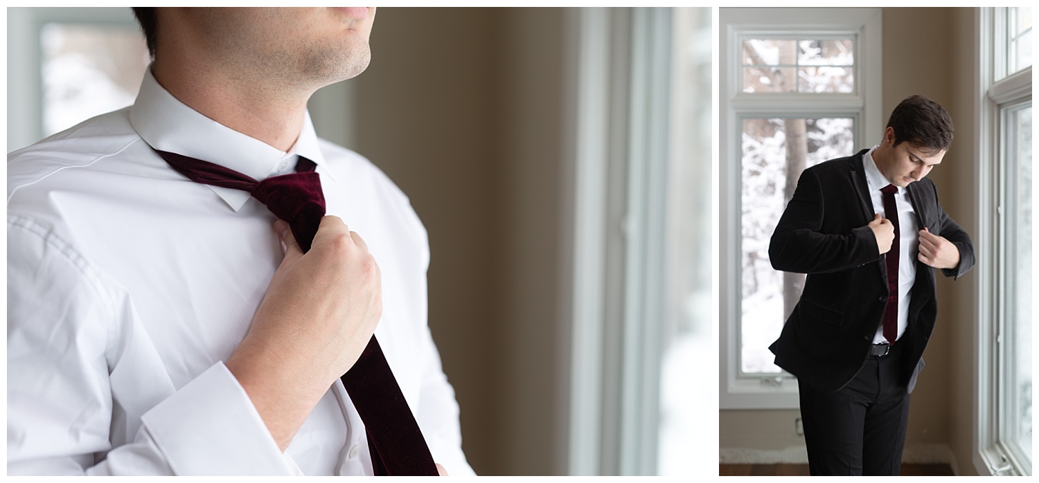 The groom finalizing his look before getting married on a snowy winter day