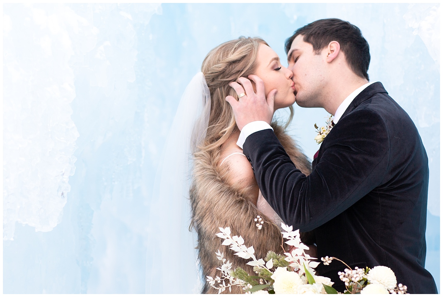 a couple shares a romantic, wintry kiss