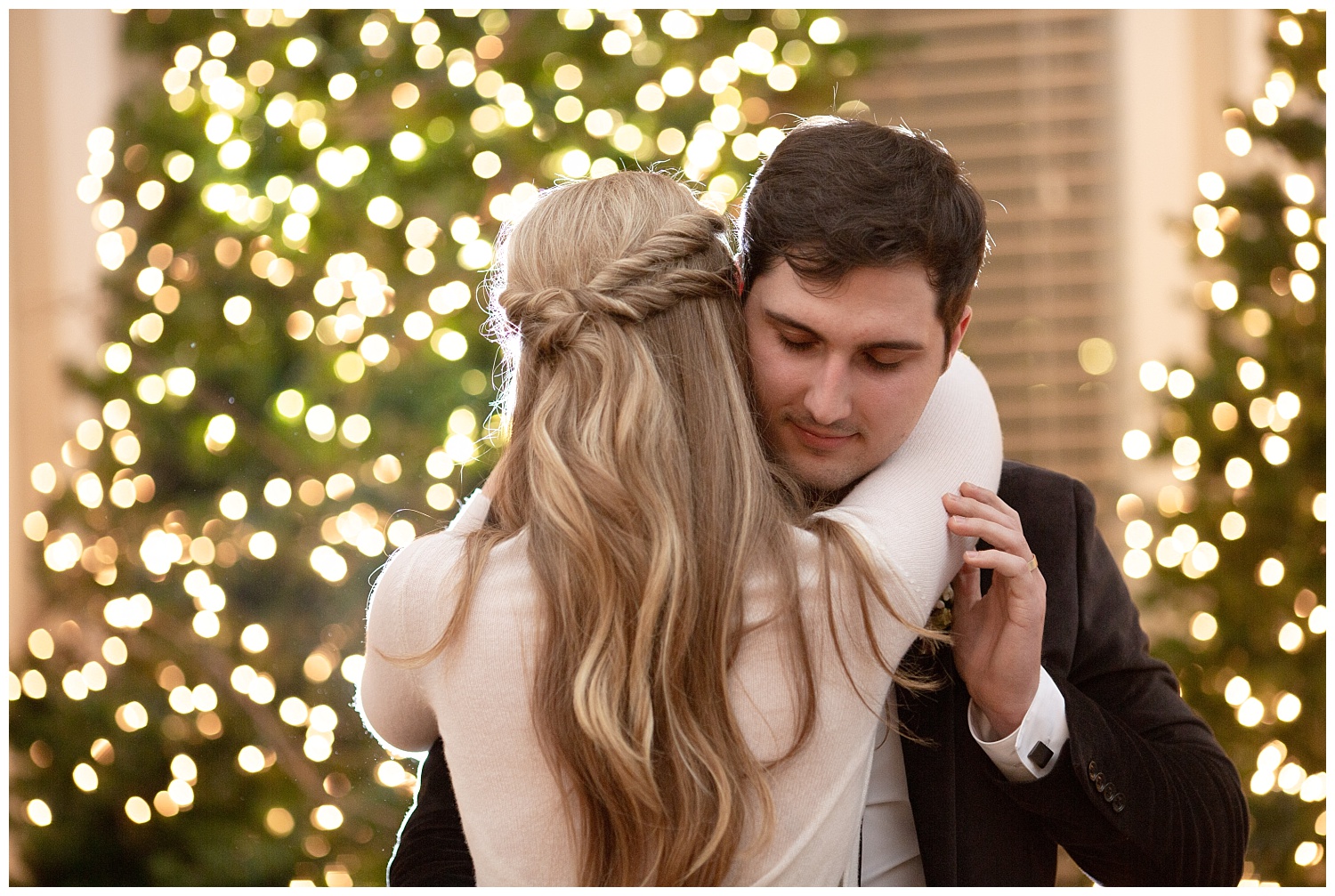 The groom hold his new wife romantically as they dance their first dance