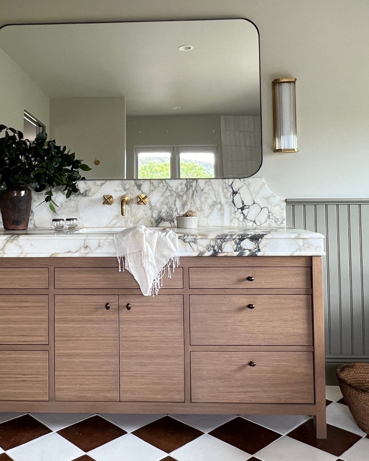 #WineCountryVilla custom vanity by RA Wilson Sonoma Cabinetry Shop. We chose a custom stained Oak Inset style flat panel door which was a compliment to our detailed Calacatta Monet marble counter edge. That counter is a FAVORITE detail on this projec