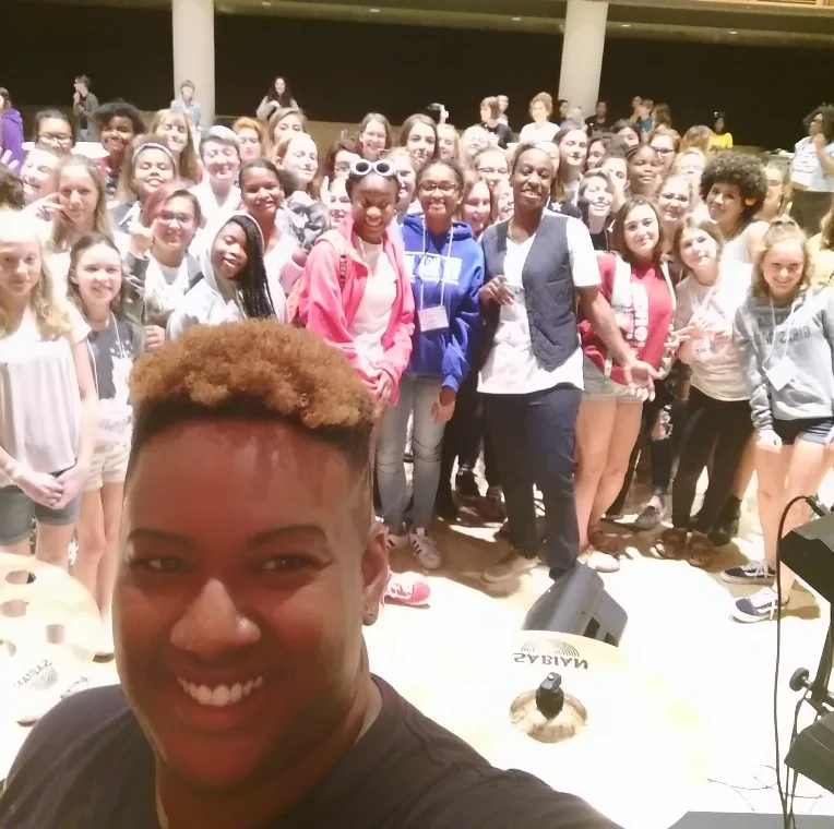 Students and Eden gathered for a fabulous, smile-filled selfie.