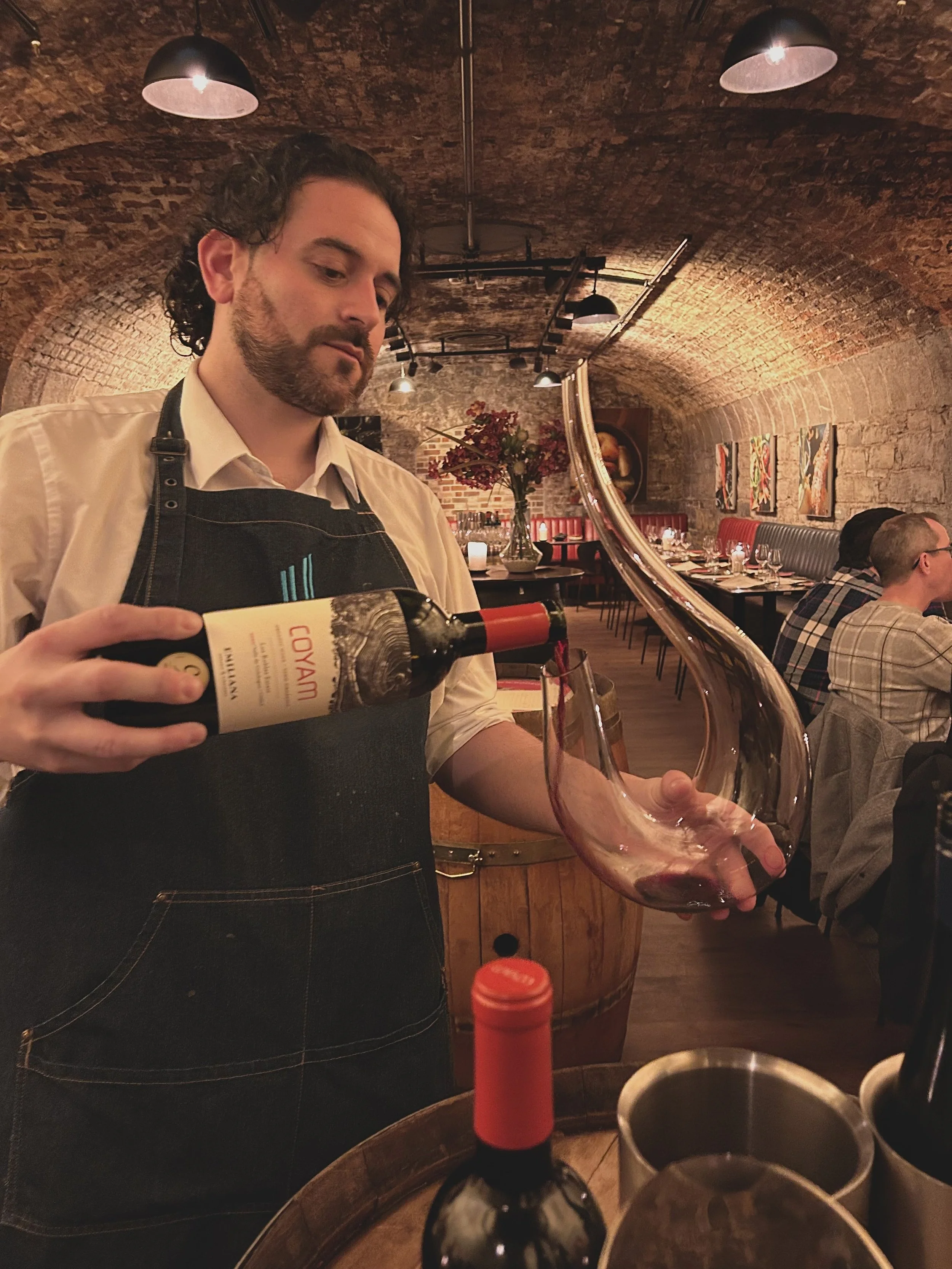 Sommelier decanting fine wine at Urban Brewing during a romantic Valentine’s Day dinner in Dublin