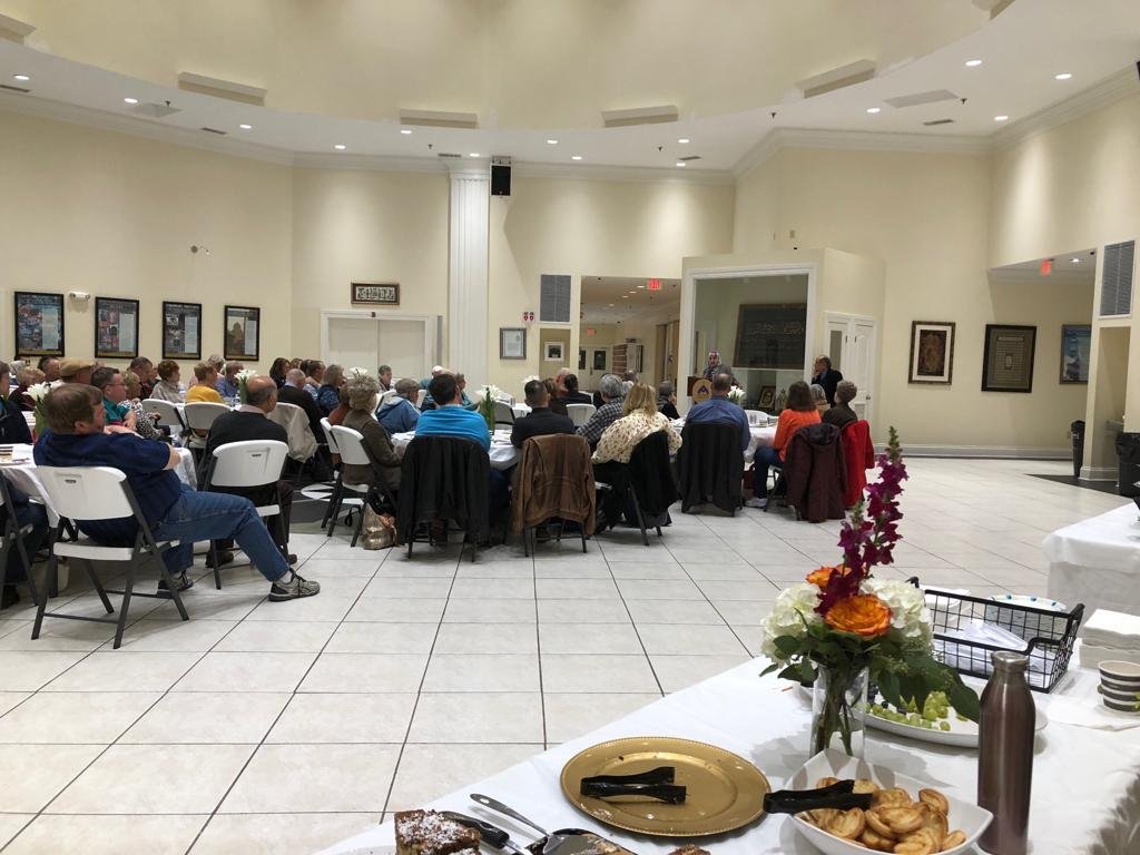 Usra speaking at Evansville Islamic Center interfaith event.jpg