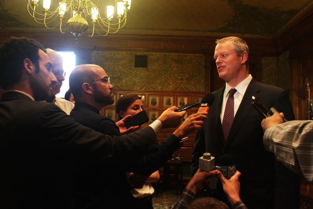  Gov. Charlie Baker holds press scrum after meeting with Senate President Stanley Rosenberg and House Speaker Robert DeLeo about the state's budget deficit for FY2017/2018. Photo by Natasha Ishak. 