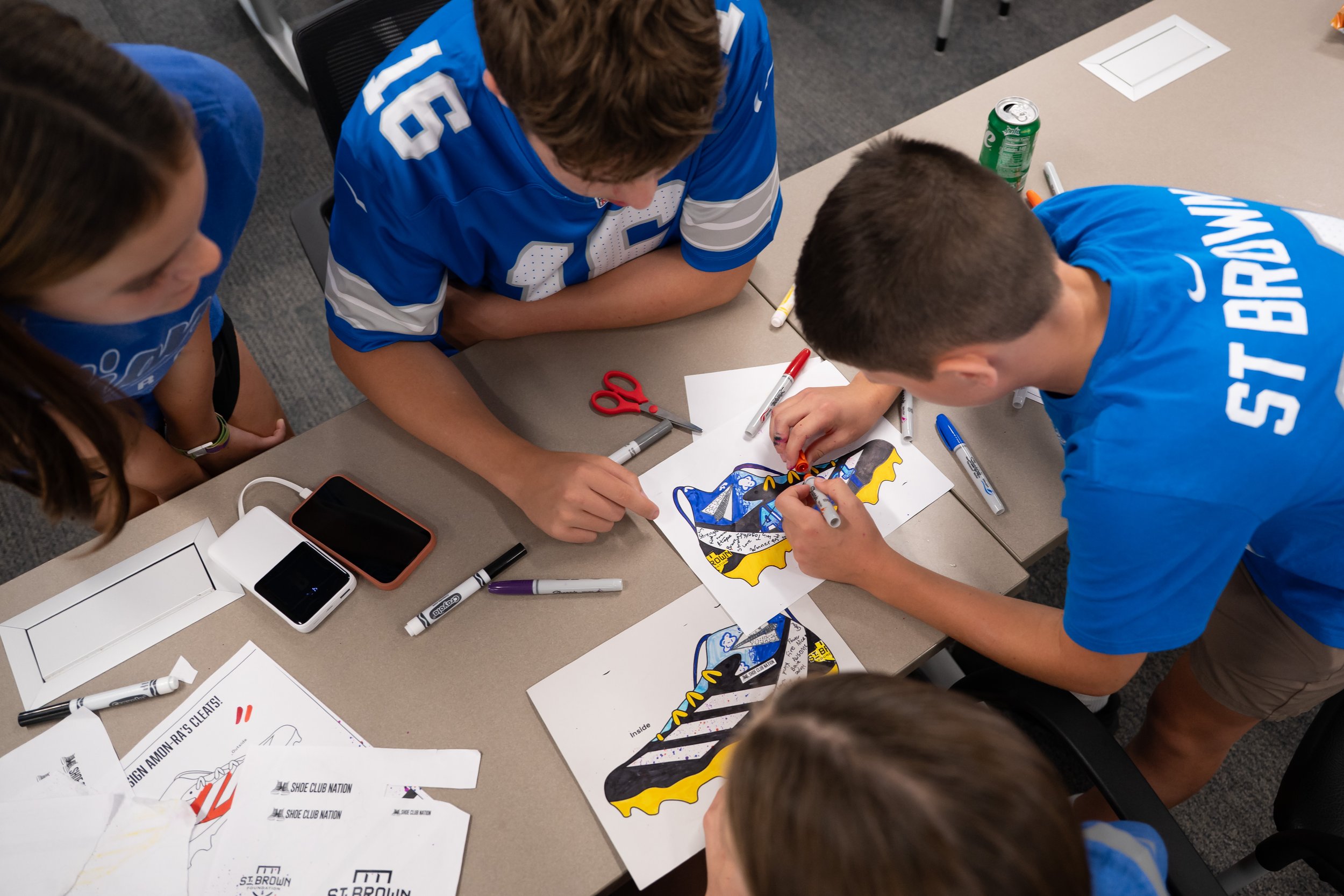 EXCLUSIVE: East Jordan Shoe Club students’ custom cleats debut on Detroit Lions’ Amon-Ra St. Brown