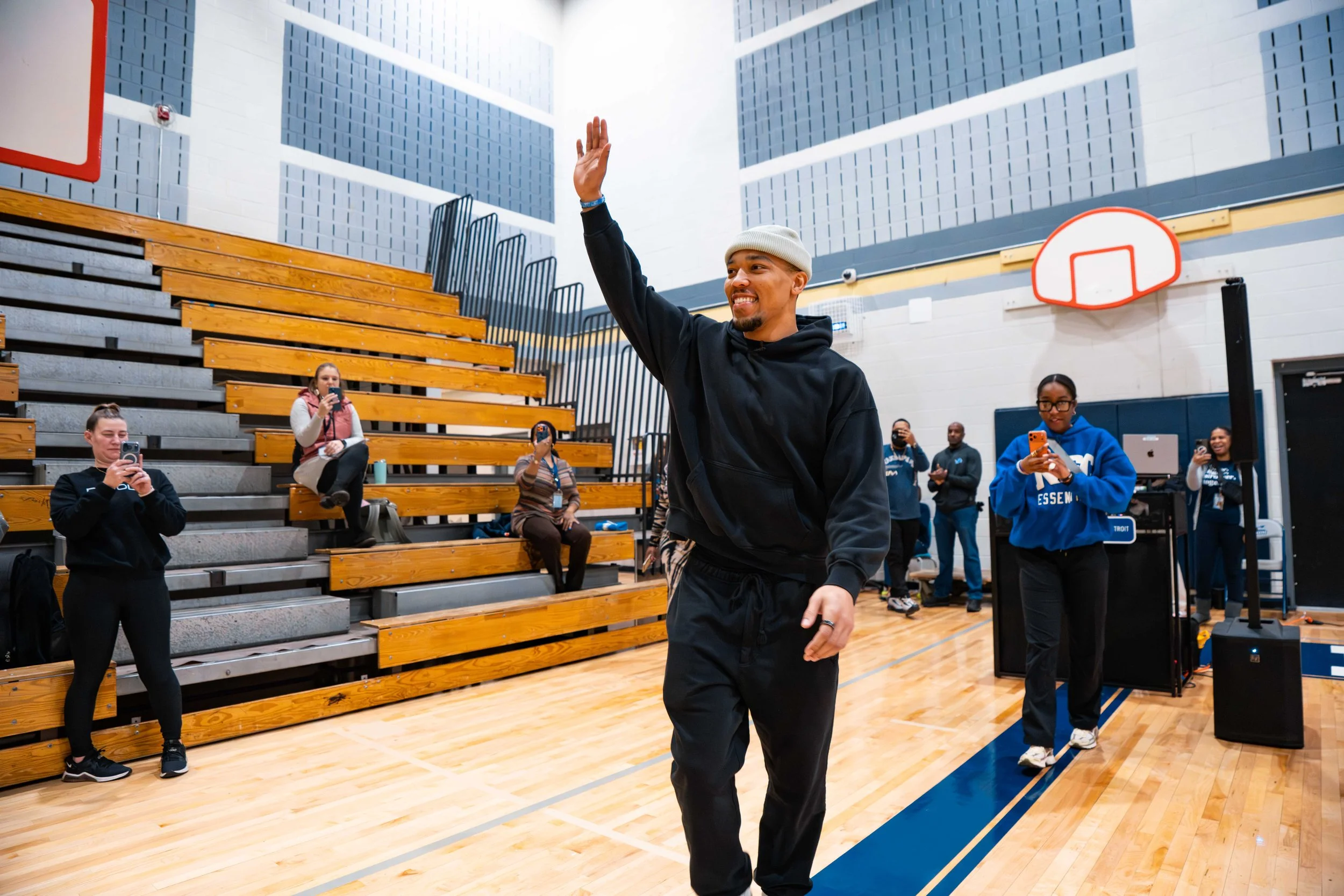 Lions' St. Brown talks to Detroit students about losses, making learning fun