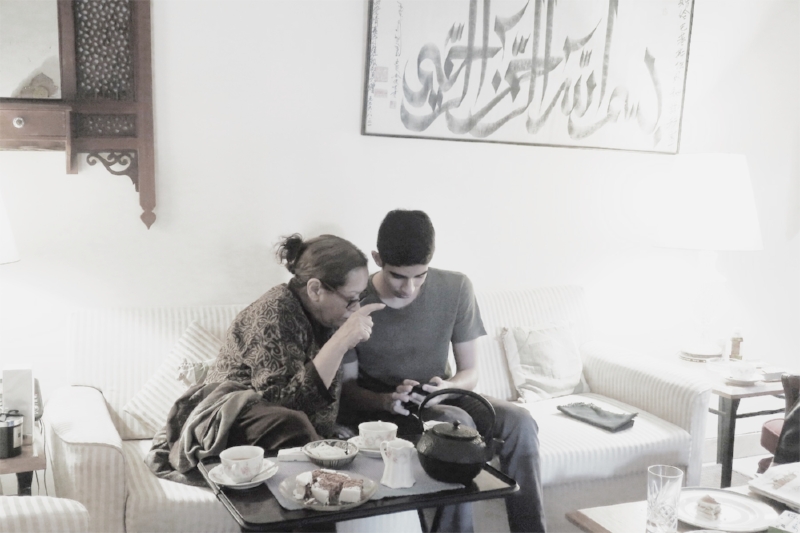 Isaad showing pics to his Dadi (paternal grandmother)