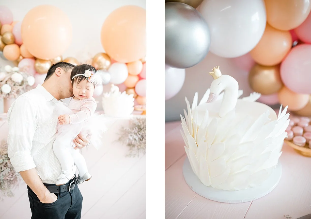 one-year-girl-at-birthday-party-with swan-shaped-cake-and-balloons.jpg