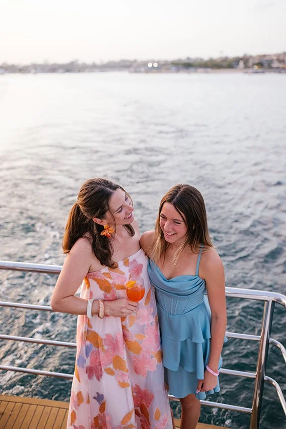 mother-and-daughter-dressed-for-a-party-at-stern-of-boat.jpg