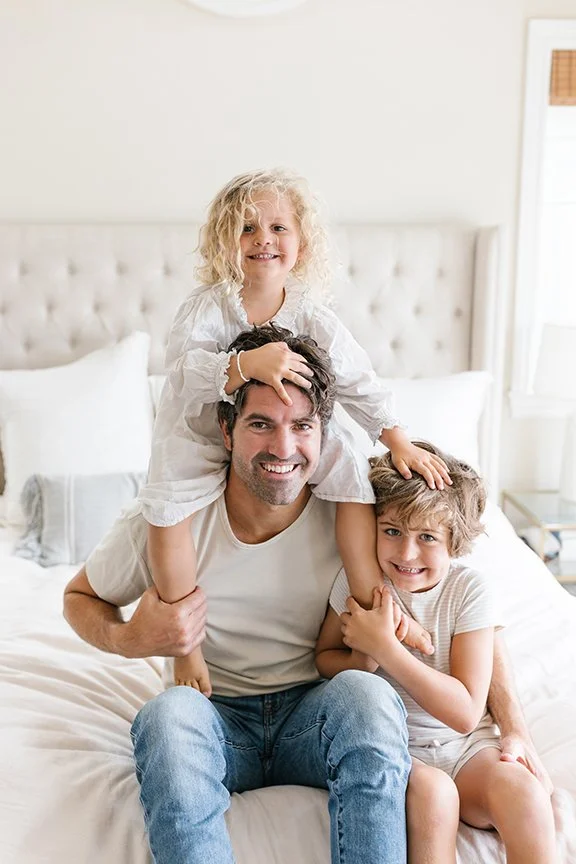 dad-with-kids-climbing-all-over-him.jpg