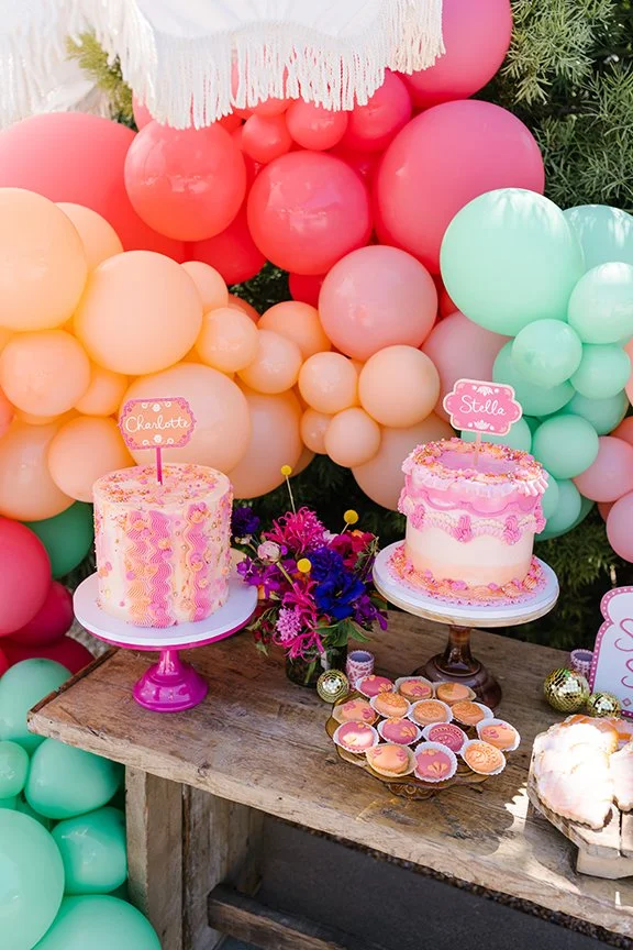 colorful-dessert-table-with-balloons-and-cakes.jpg