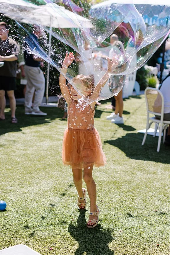 girl-jumping-for-bubbles.jpg