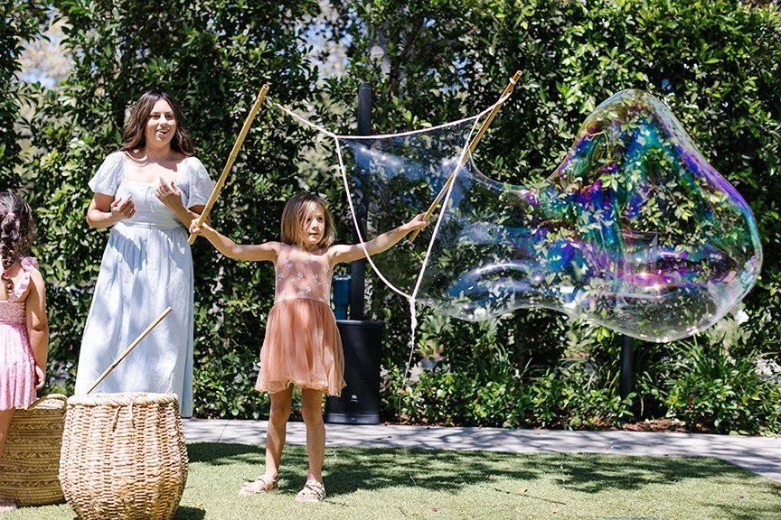 girl-making-extra-large-bubbles.jpg