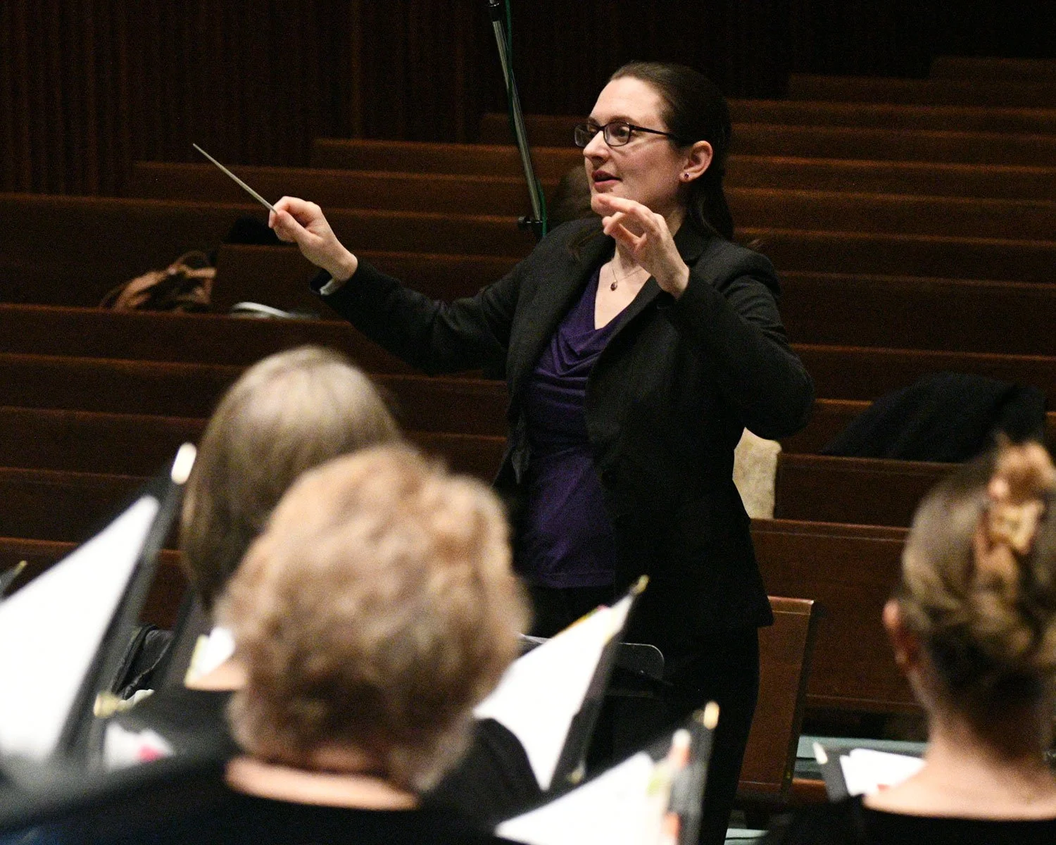 Sarah Riskind warms up the BACH choir