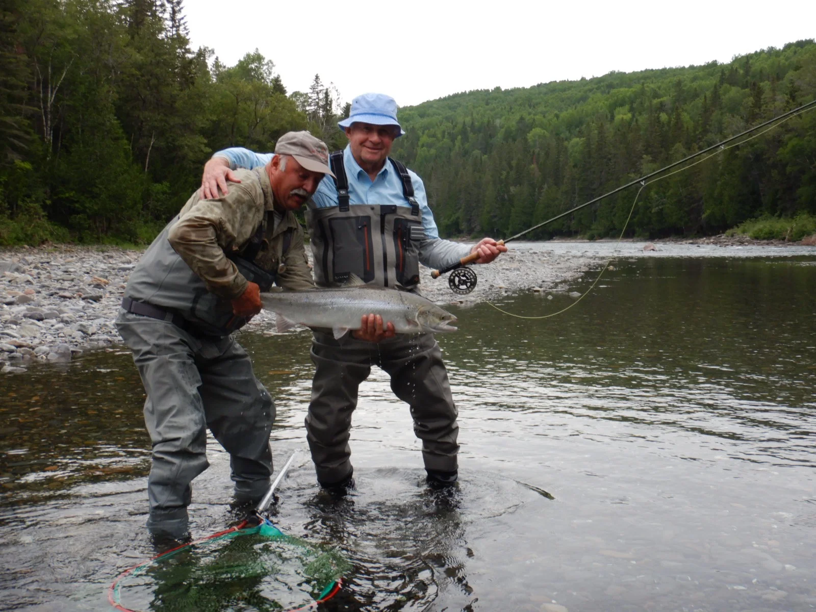 Long time Club guest Sheldon Aaron (right) landed this fine salmon on his first day out, congratulations Sheldon!