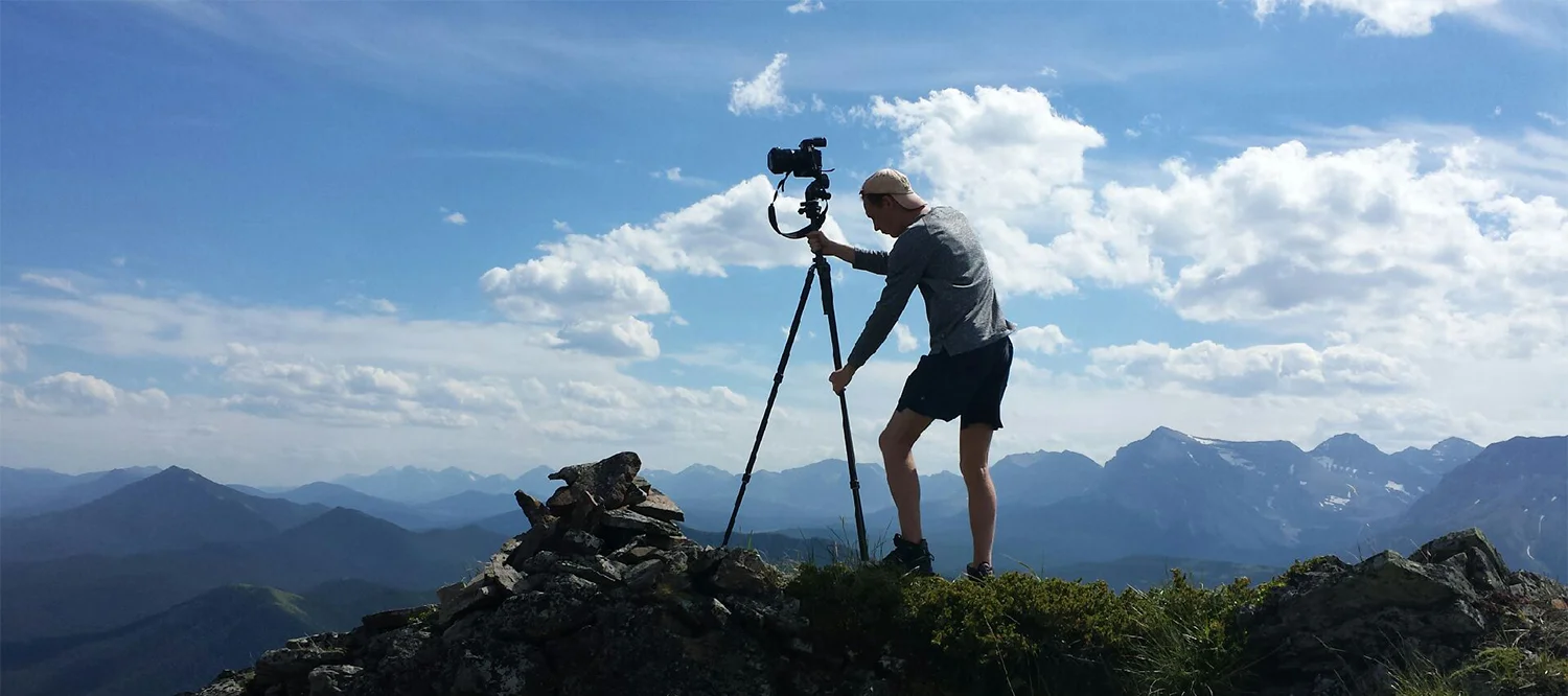 Karson Sudlow sets up the tripod to repeat the photos of the Tuttle 1942 survey (see historical image here ). Photo by S. Voicescu.