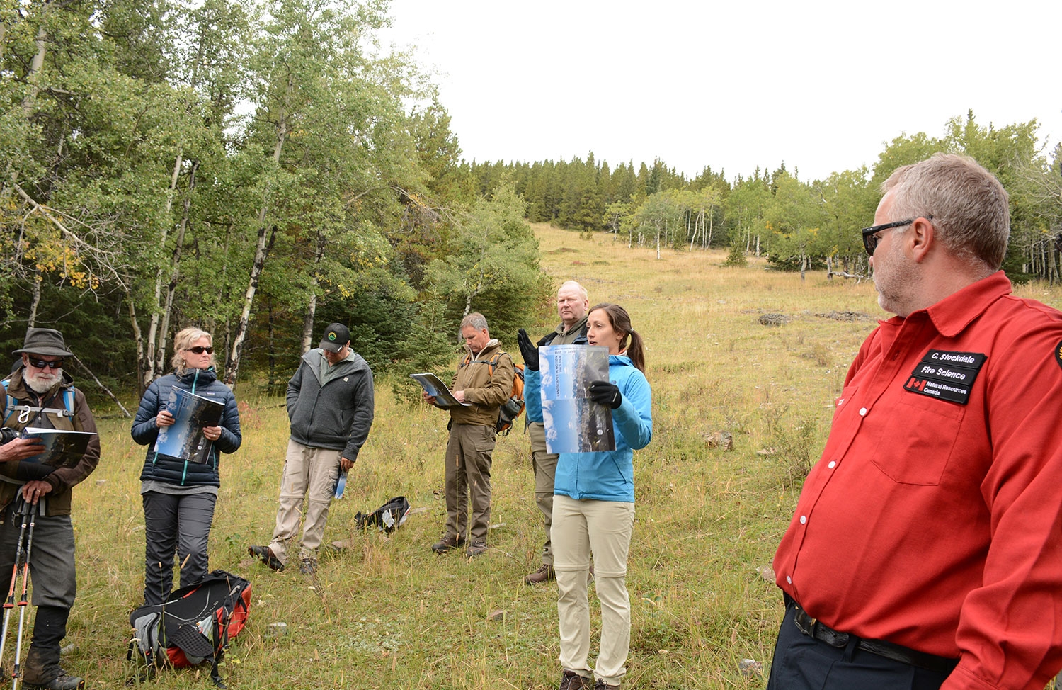 Julie Fortin (centre) and Chris Stockdale (right) present to the group. Photo by Cameron Naficy.