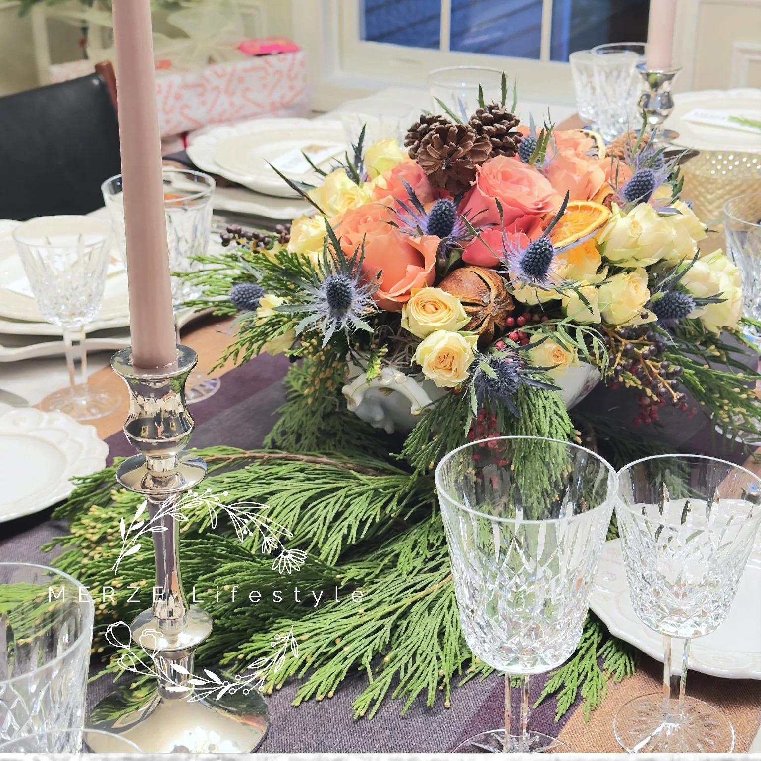 Sterling silver flatware and Waterford crystal reflecting candlelight