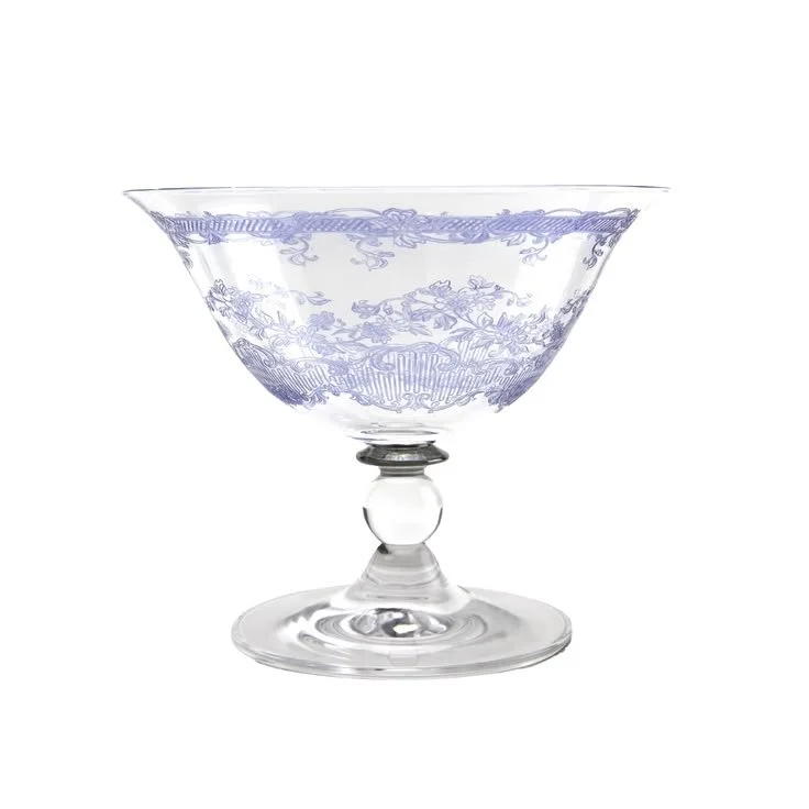 Clear etched glass compote dish with a footed stem and scrolling floral pattern
