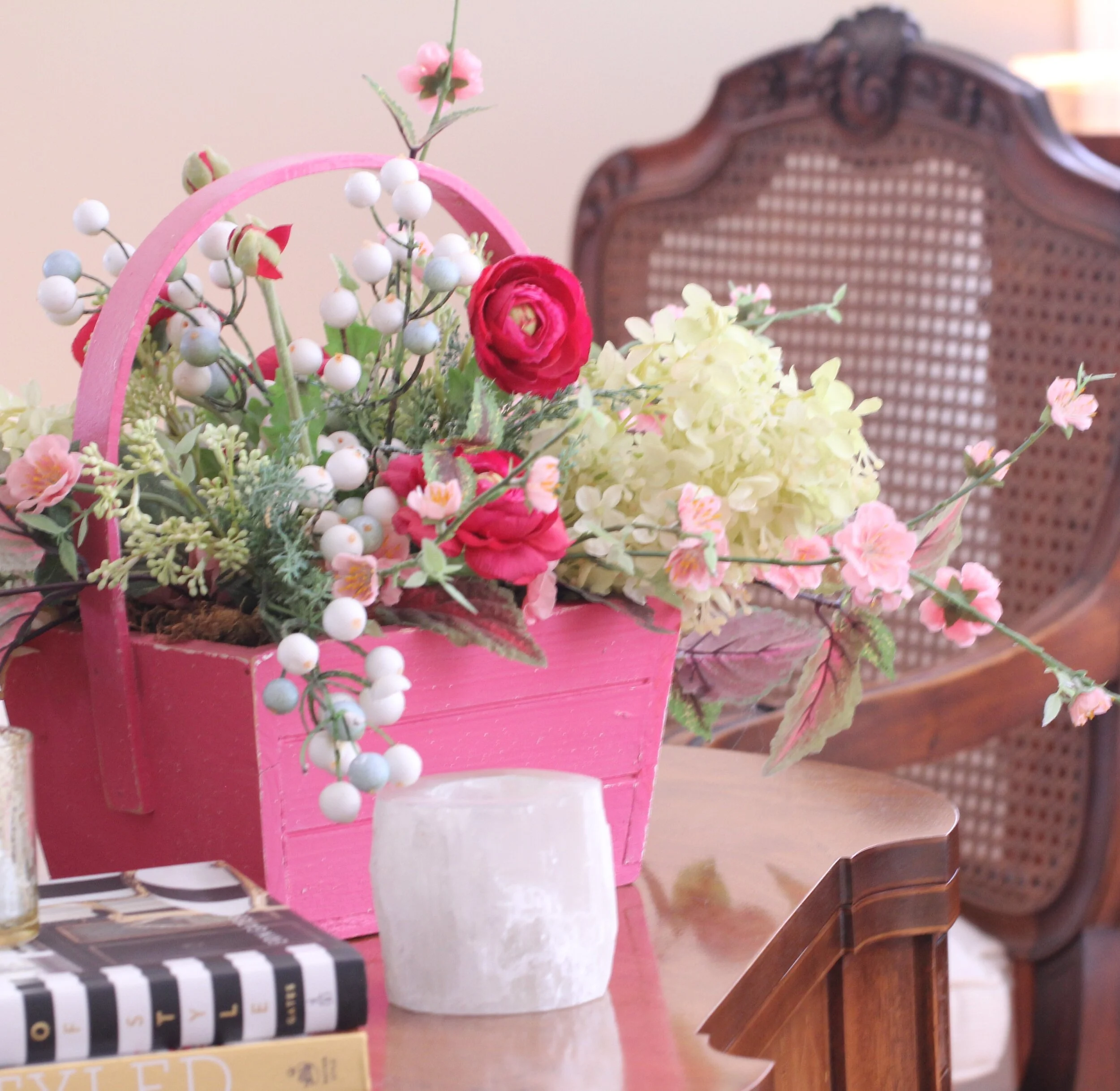 interior vignette with books flowers and decorative objects