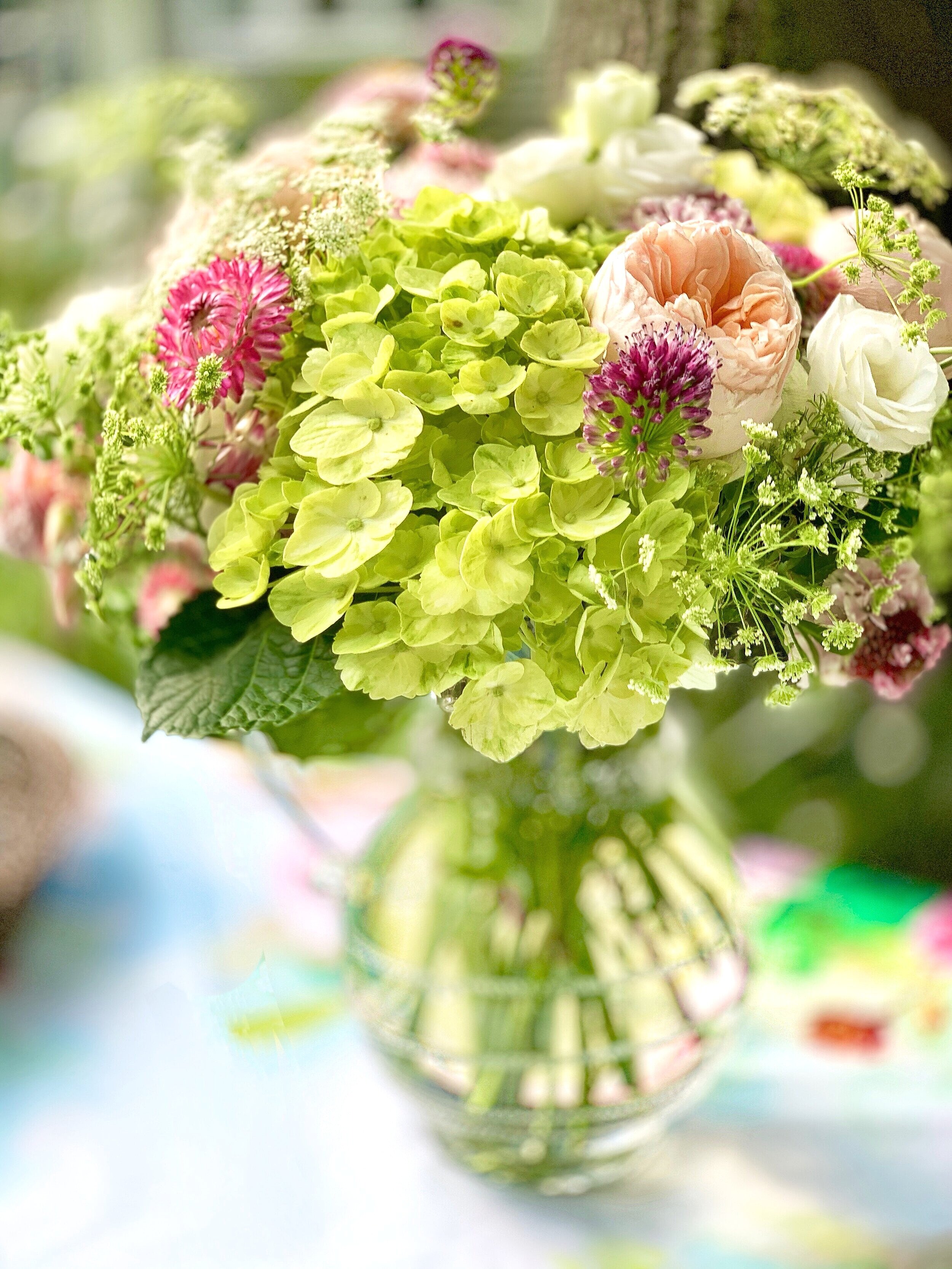 Green hydrangeas and light pink David Austin Roses filled this casual bouquet. I love the color combination with a linen floral tablecloth.