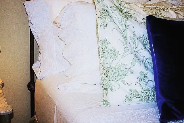 array of linens arranged for a comfortable bed
