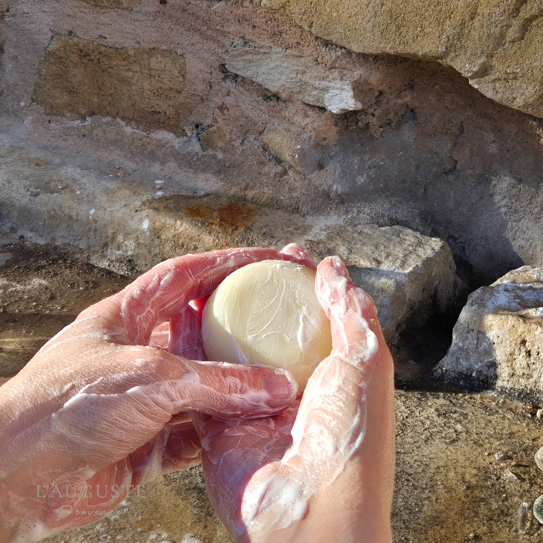 Hands using botanical soap creating lather showing skincare transforming on contact with the skin