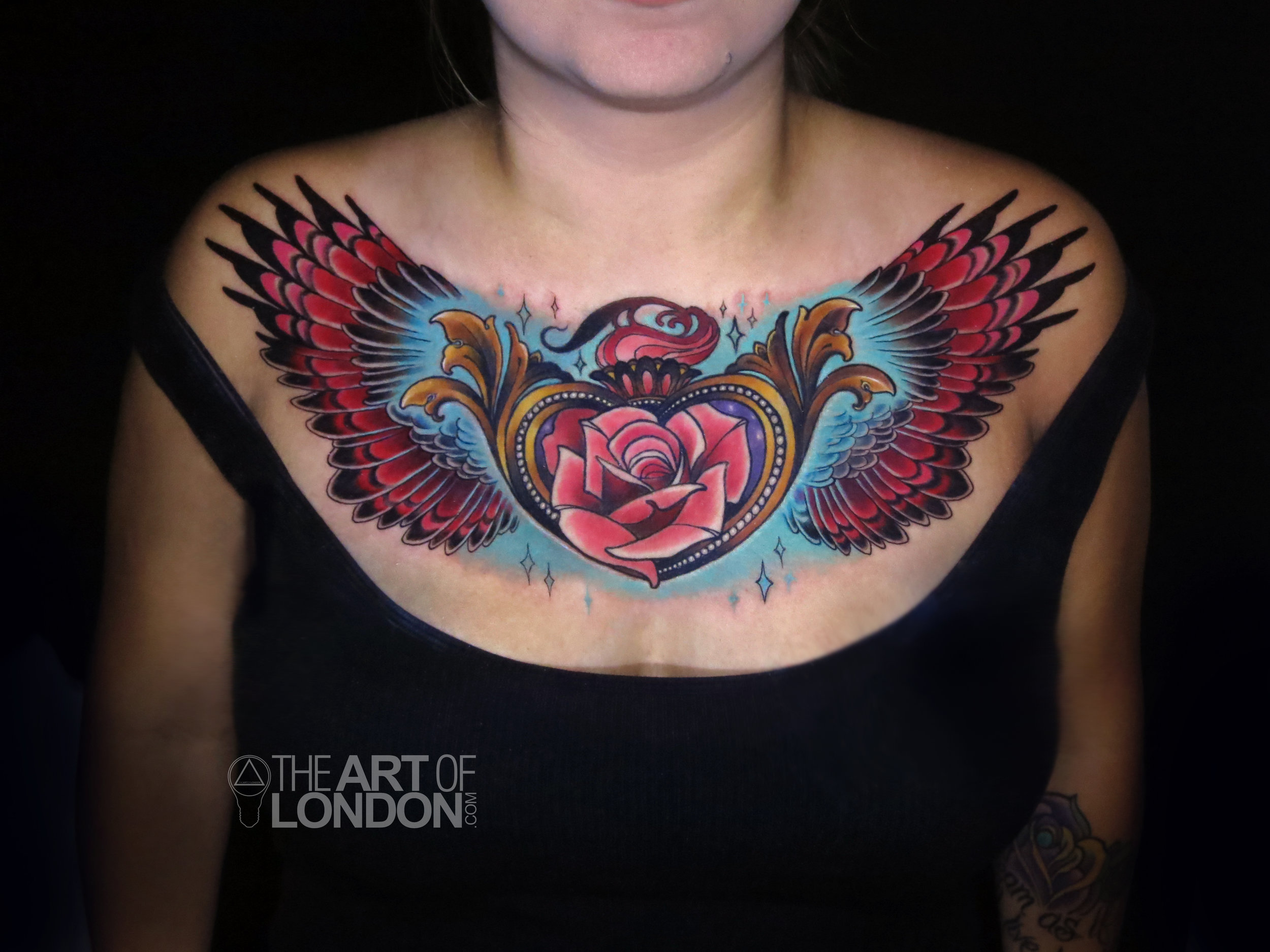 rose heart locket wings chest piece tattoo.jpg