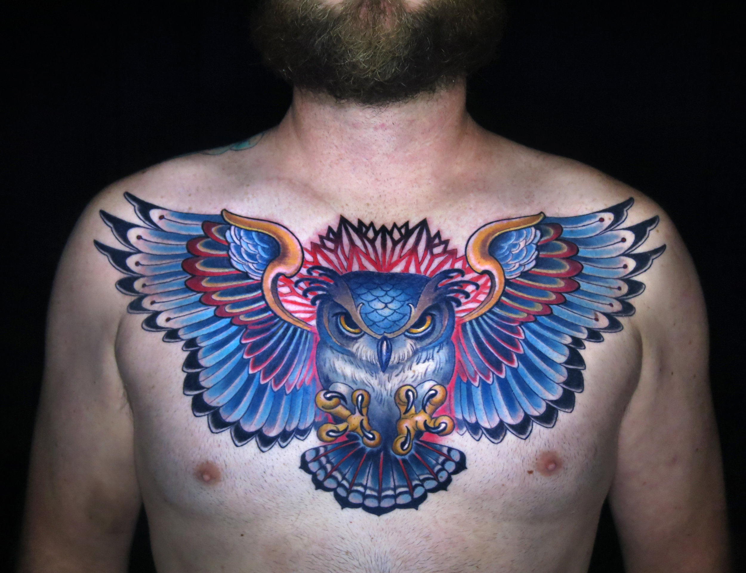 sacred owl neo trad chest color tattoo.jpg