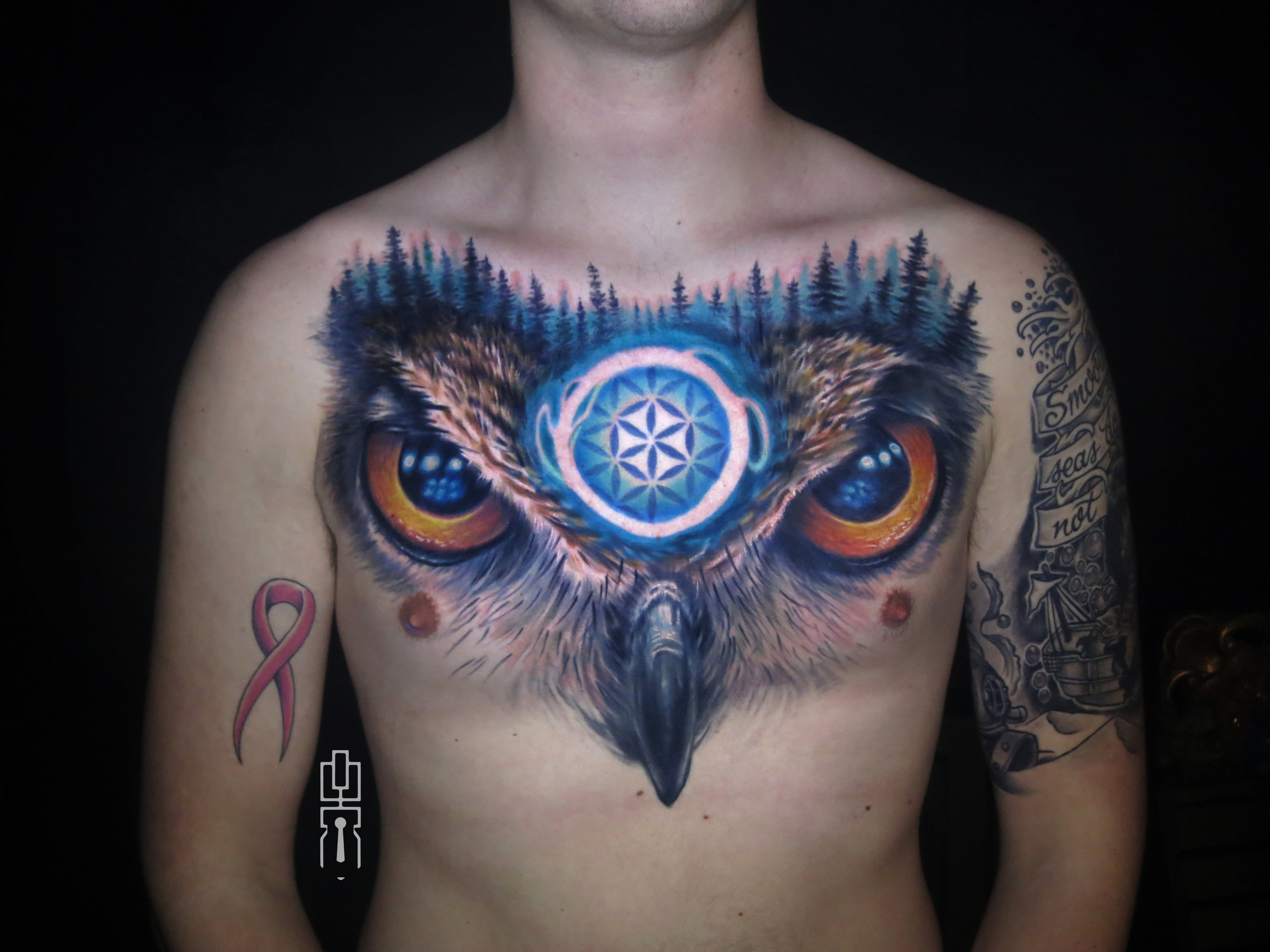 sacred flower of life owl chest piece tattoo.jpg