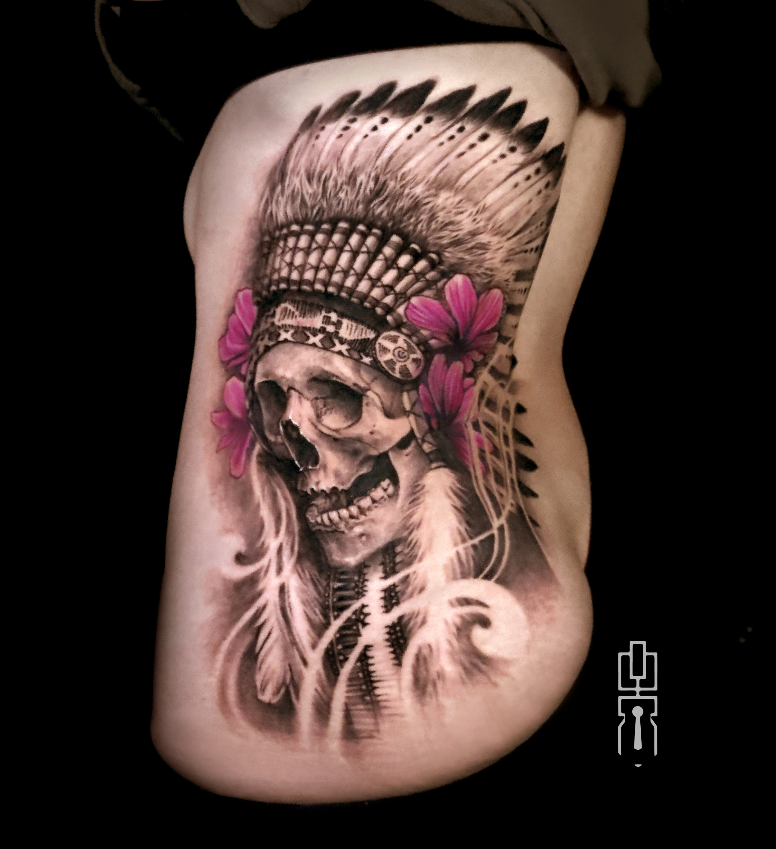 native headdress skull black n grey ribs tattoo.jpg