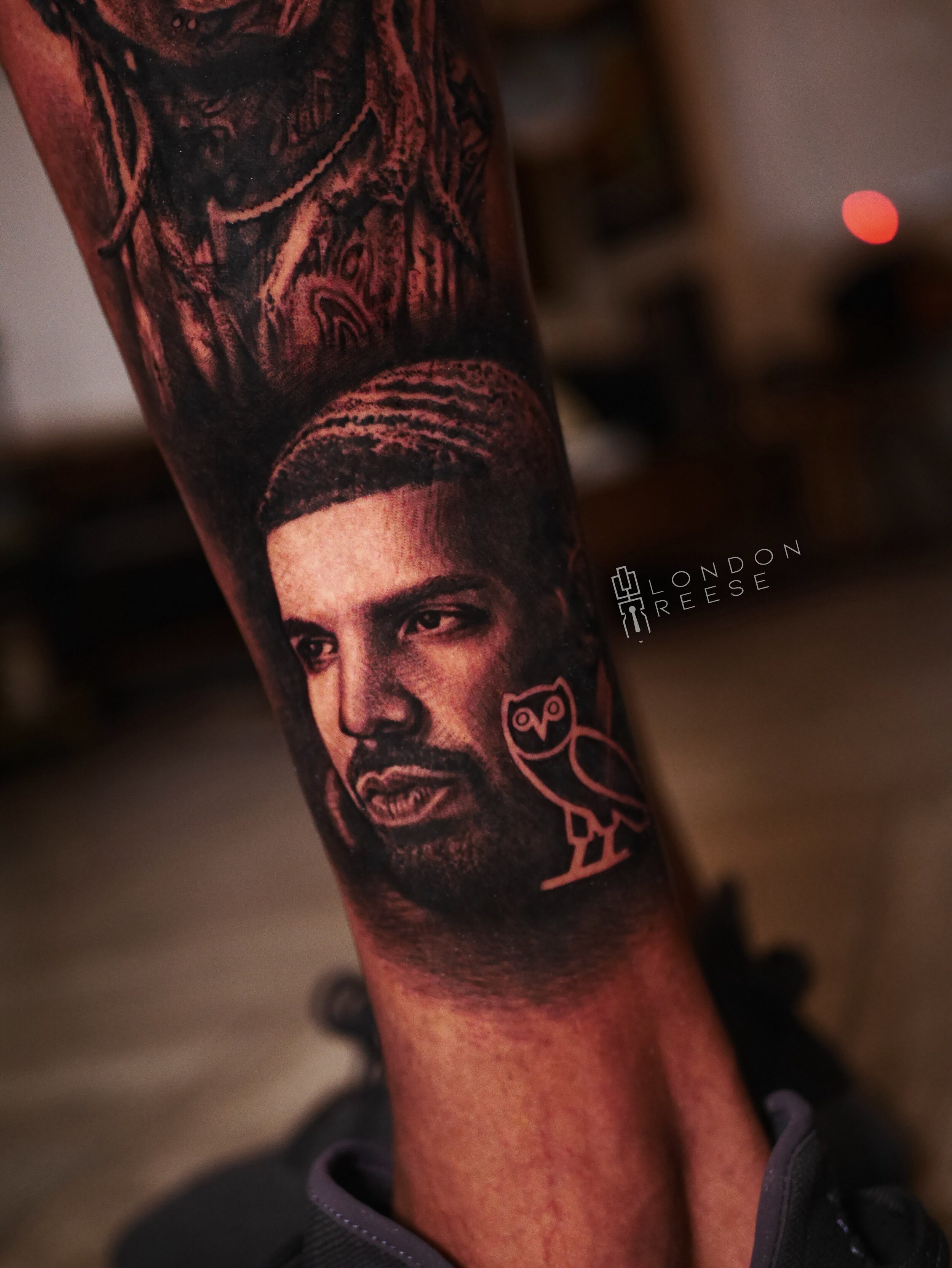drake scorpion ovo tattoo.jpg