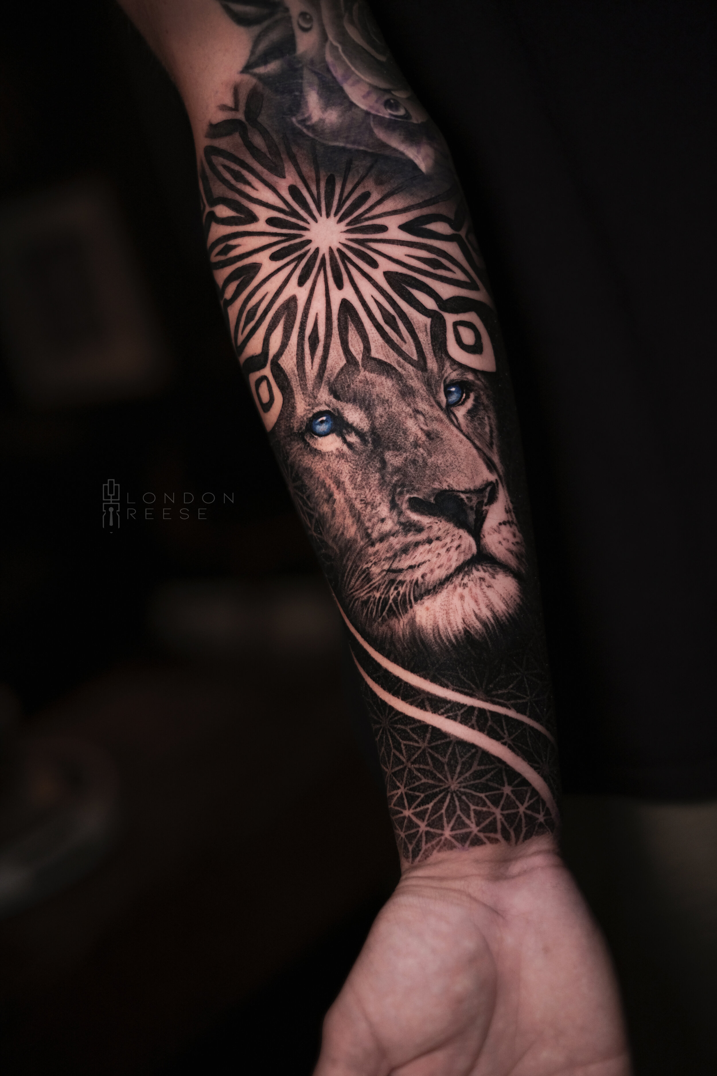 sacred geo mandala lion blue eyes tattoo.jpg