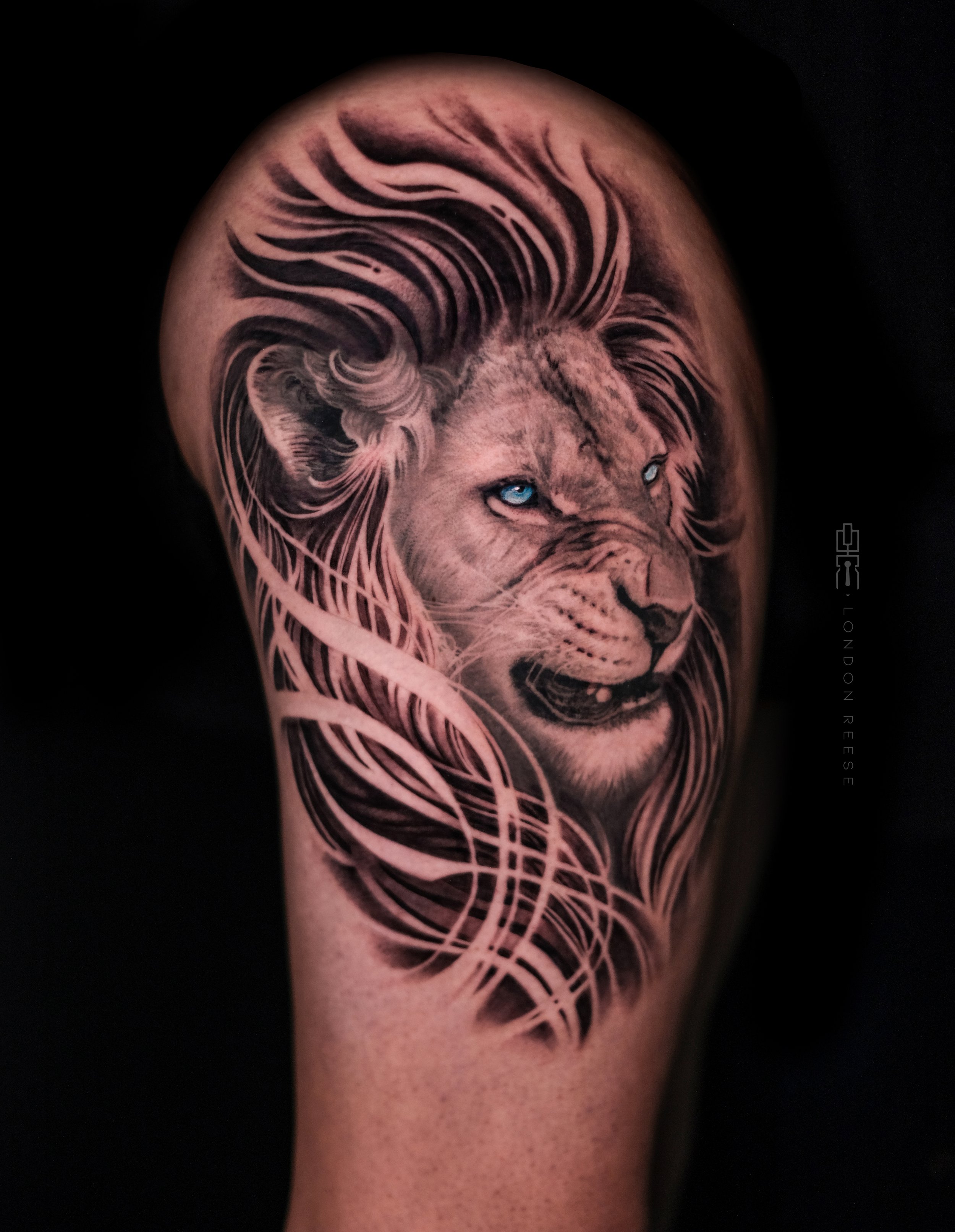 deathless lion blue eyes tattoo.jpg