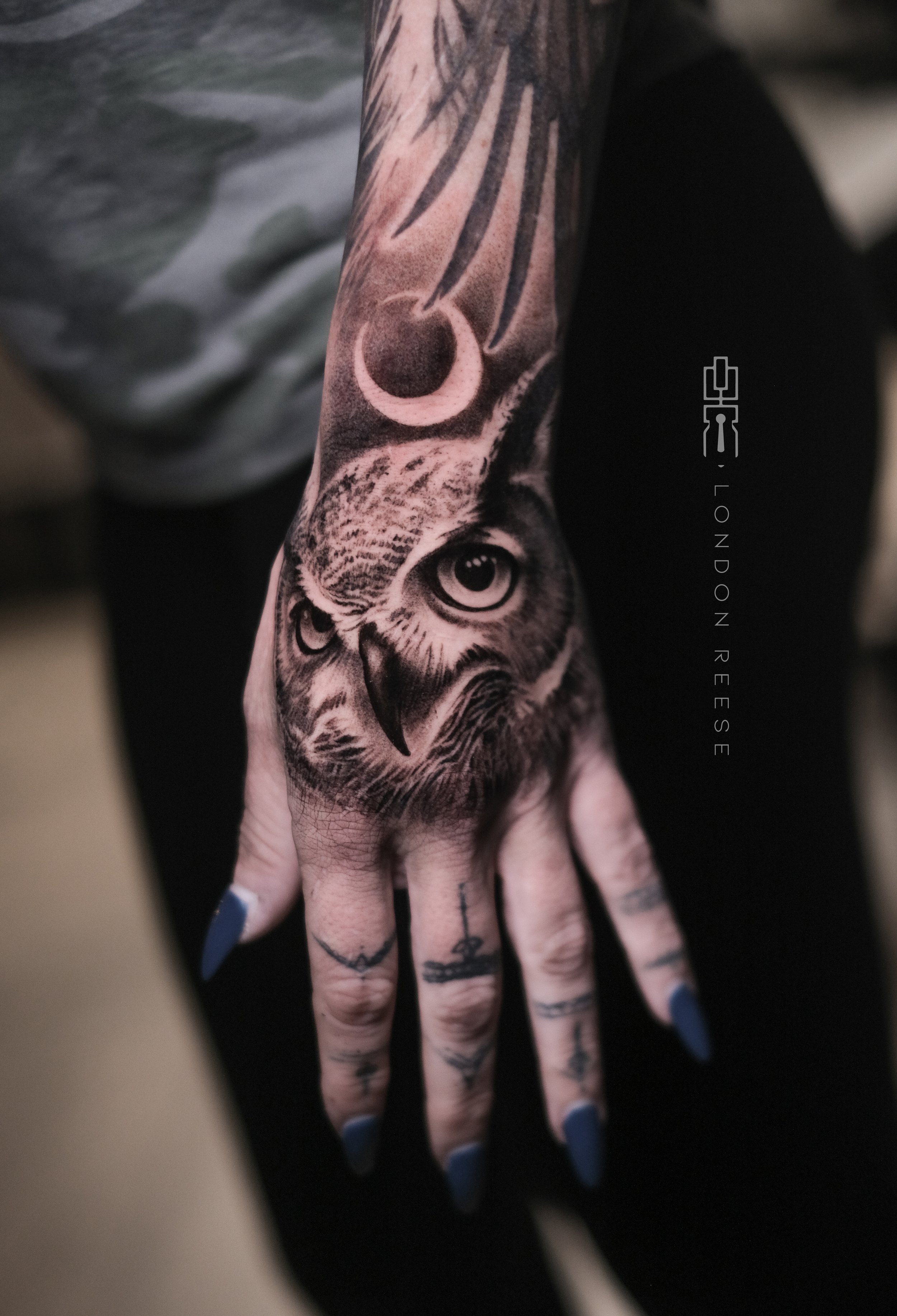 great horned owl tattoo hand tattoo.jpg