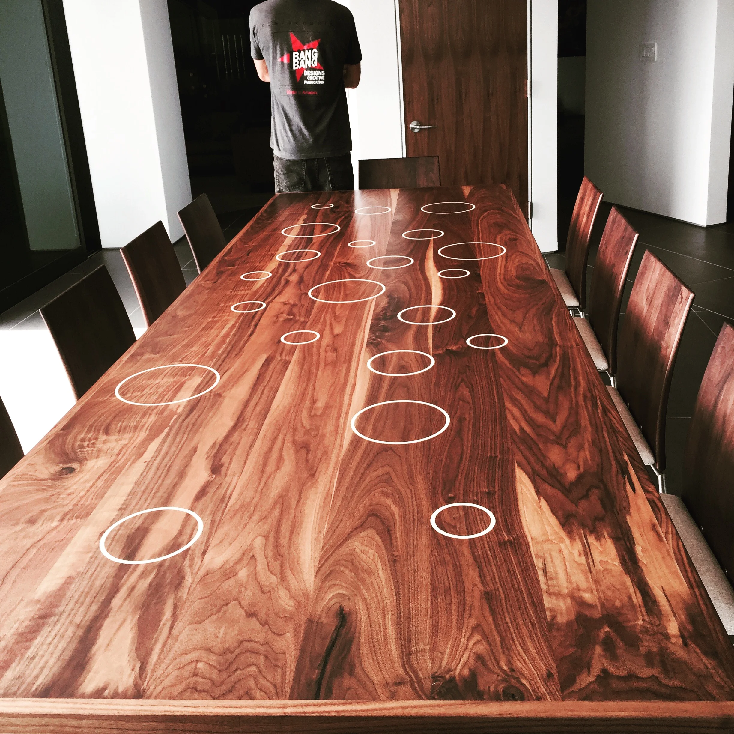 Walnut table top with white stone inlays.JPG