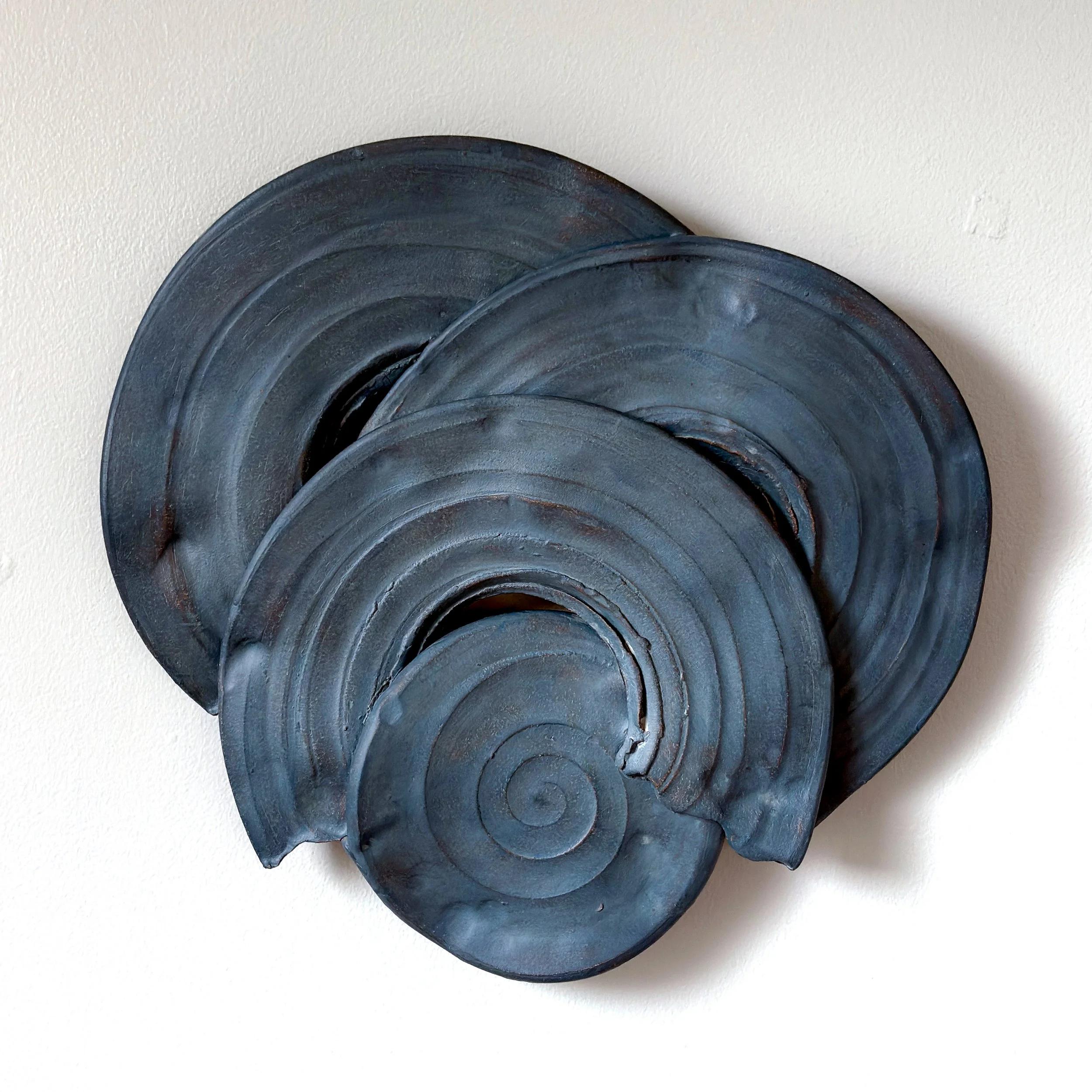 altered set of three black plates