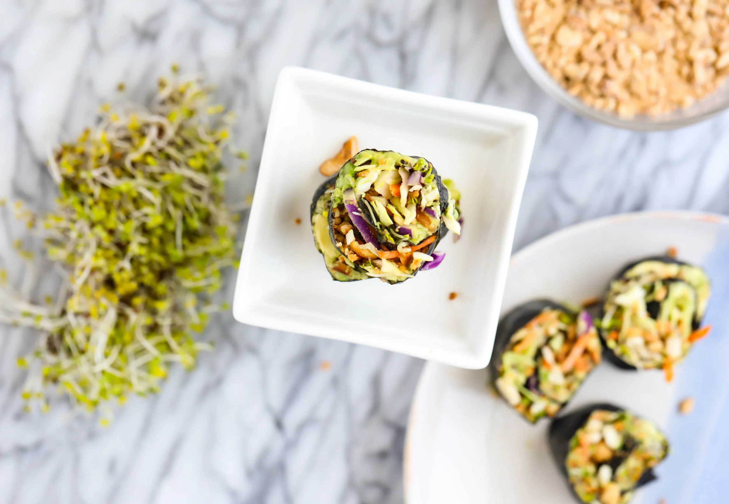 I always have nori on hand. It is a nutritious "wrap" option and makes for a quick and delicious lunch. The contents don't have to resemble traditional sushi either! Roll up whatever you would like. This vegan version has to be one of my favorite nori concoctions and make a great snack, appetizer or side dish. Dip in coconut aminos to round them out!