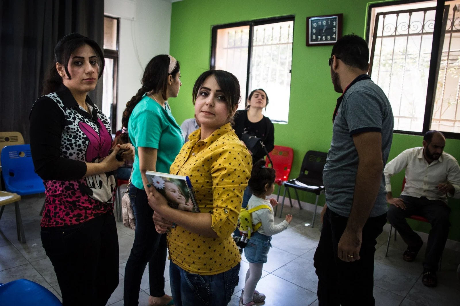 Iraqi Christian women talk together after an English class at Collateral Repair Project’s community center. Many of the families who come to the center are awaiting resettlement in other countries, and want to learn English to prepare for their new life, or in hopes of finding better job opportunities in Jordan.