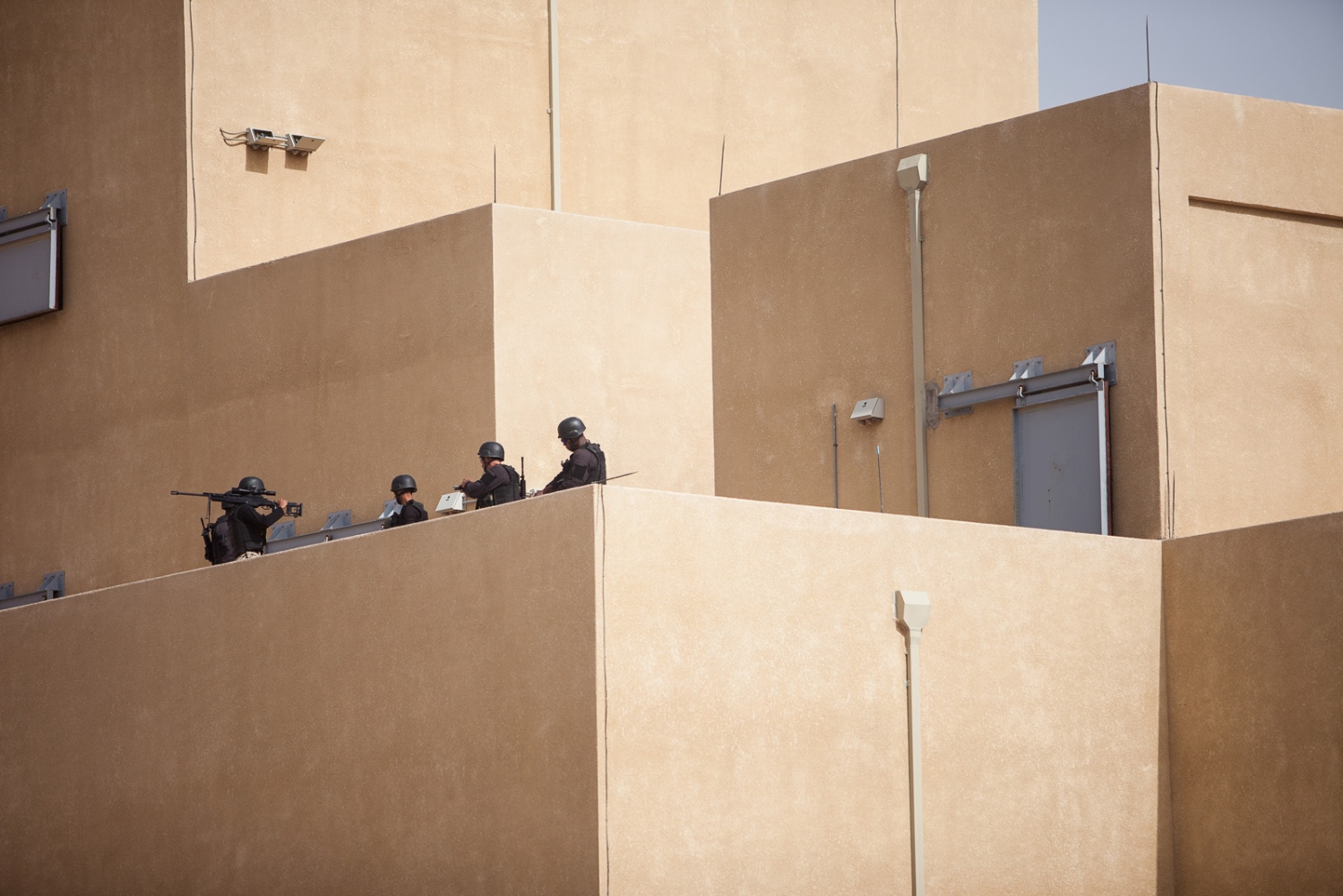  Soldiers wait for instructions atop a tower during the "Urban Assault" event on April 20, 2015, during the seventh annual Warrior Competition near Amman, Jordan. The center, which spans 25 acres of a blasted-out desert canyon, is a state-of-the-art 