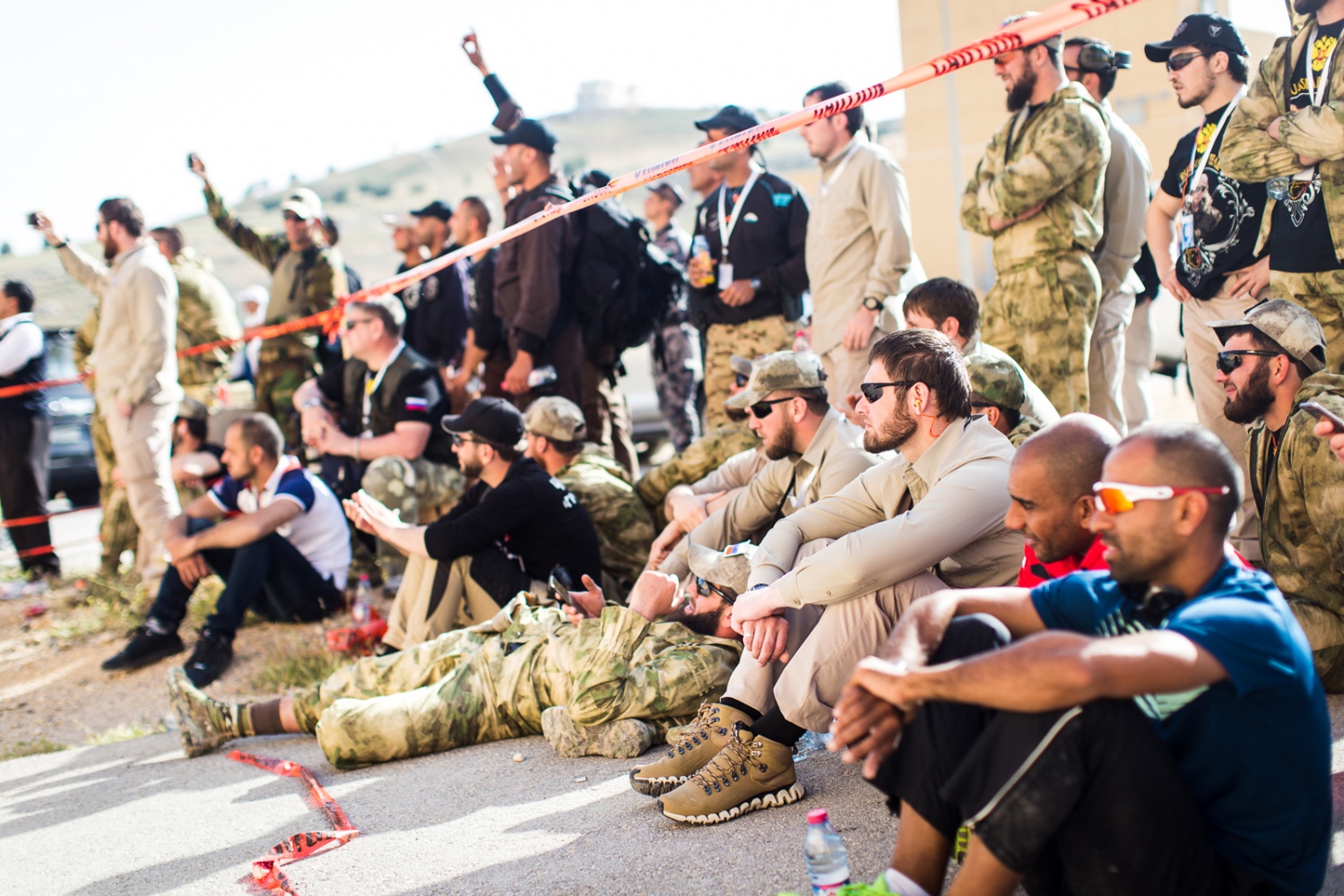  Teams from various countries relax together and cheer on their teammates during the first event of the Warrior Competition, "Top Gun." Elite counter-terrorism teams from around the world compete for the title of champion at the King Abdullah II Spec